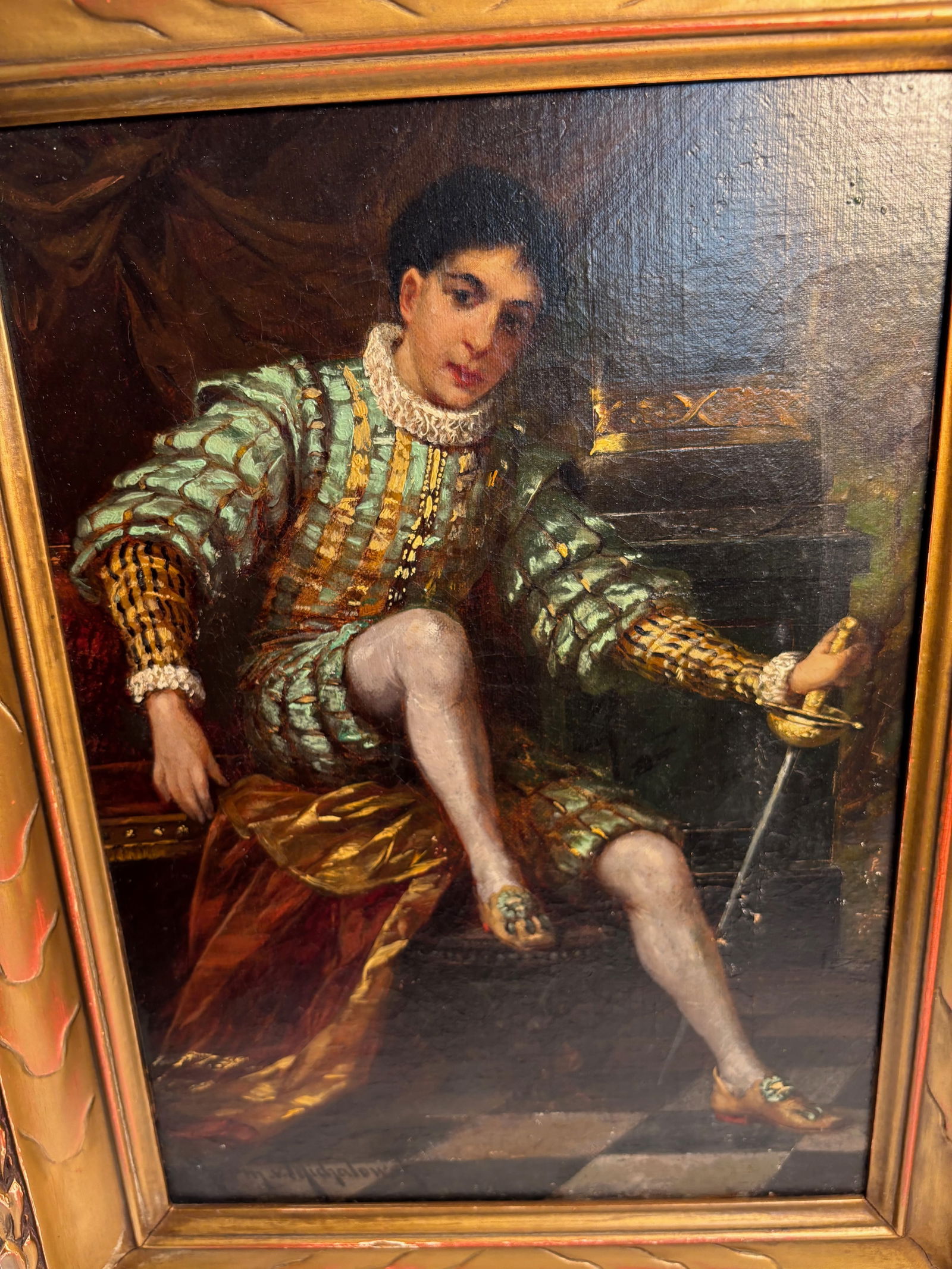 Herman von Michalowski (German, 1849–1912), “Portrait of a Young Nobleman in Renaissance: A finely detailed oil on canvas depicting a young nobleman seated in an interior, dressed in elaborate Renaissance attire with gilt-thread doublet and ruffled collar, holding a slender sword in one