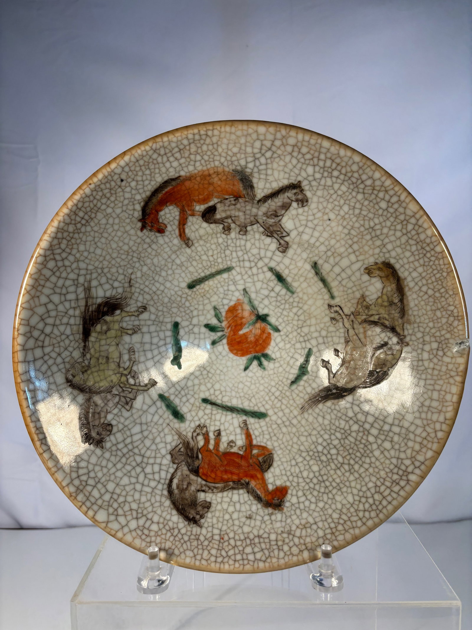 A Chinese Crackle-Glazed Porcelain Douli Bowl: Qing Dynasty(1644-1912), A Chinese porcelain bowl, decorated in famille verte enamels with two five-clawed dragons, one red and one green, each pursuing a flaming pearl amidst cloud scrolls, all reser