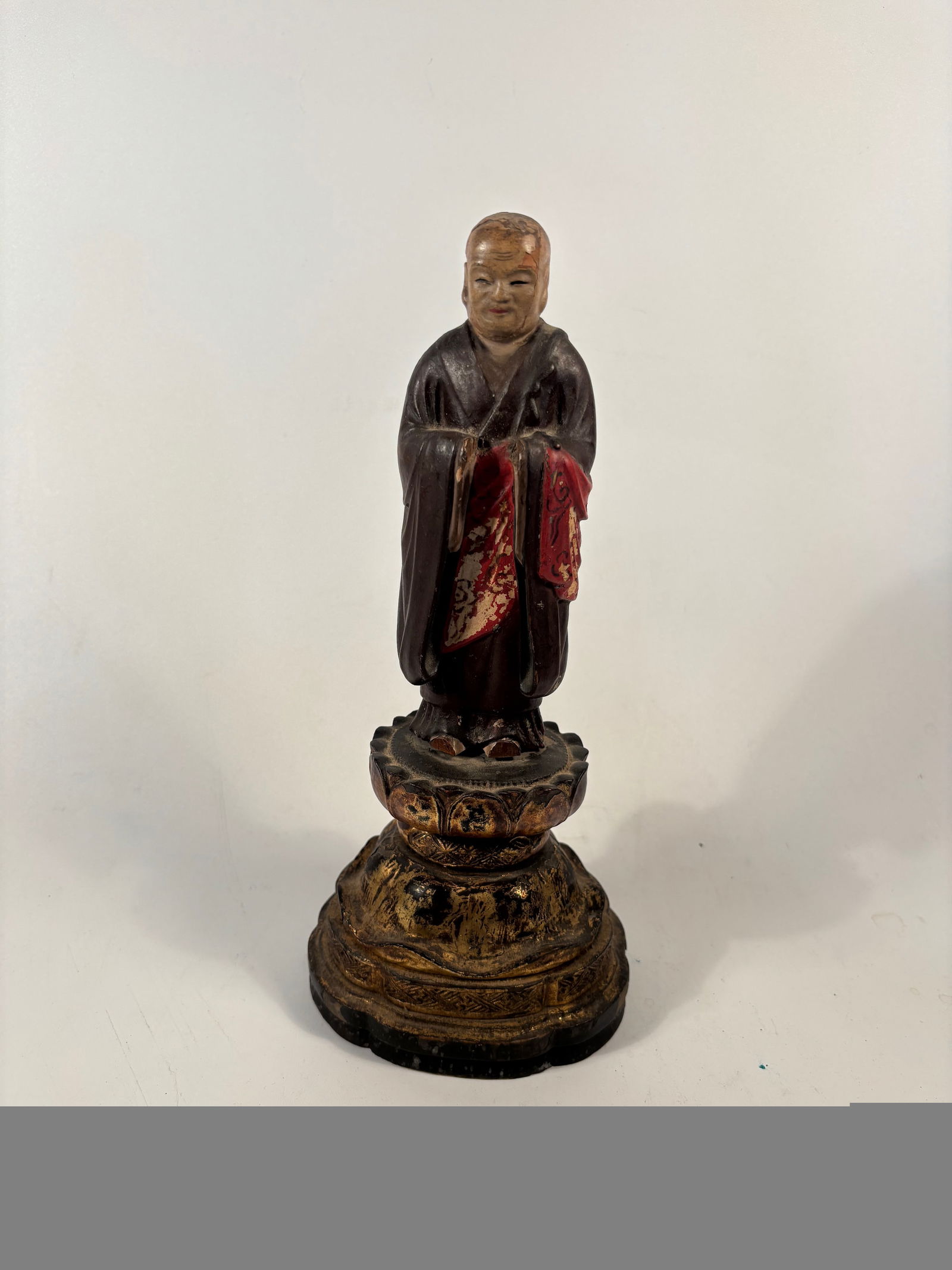 A Chinese Polychrome Wood Figure of a Buddhist Monk – c. 1850.: 19th century, A finely carved and painted Chinese wooden figure of a Buddhist monk, dating to the mid-19th century (circa 1850, Qing Dynasty). The figure stands with hands joined in front of the chest