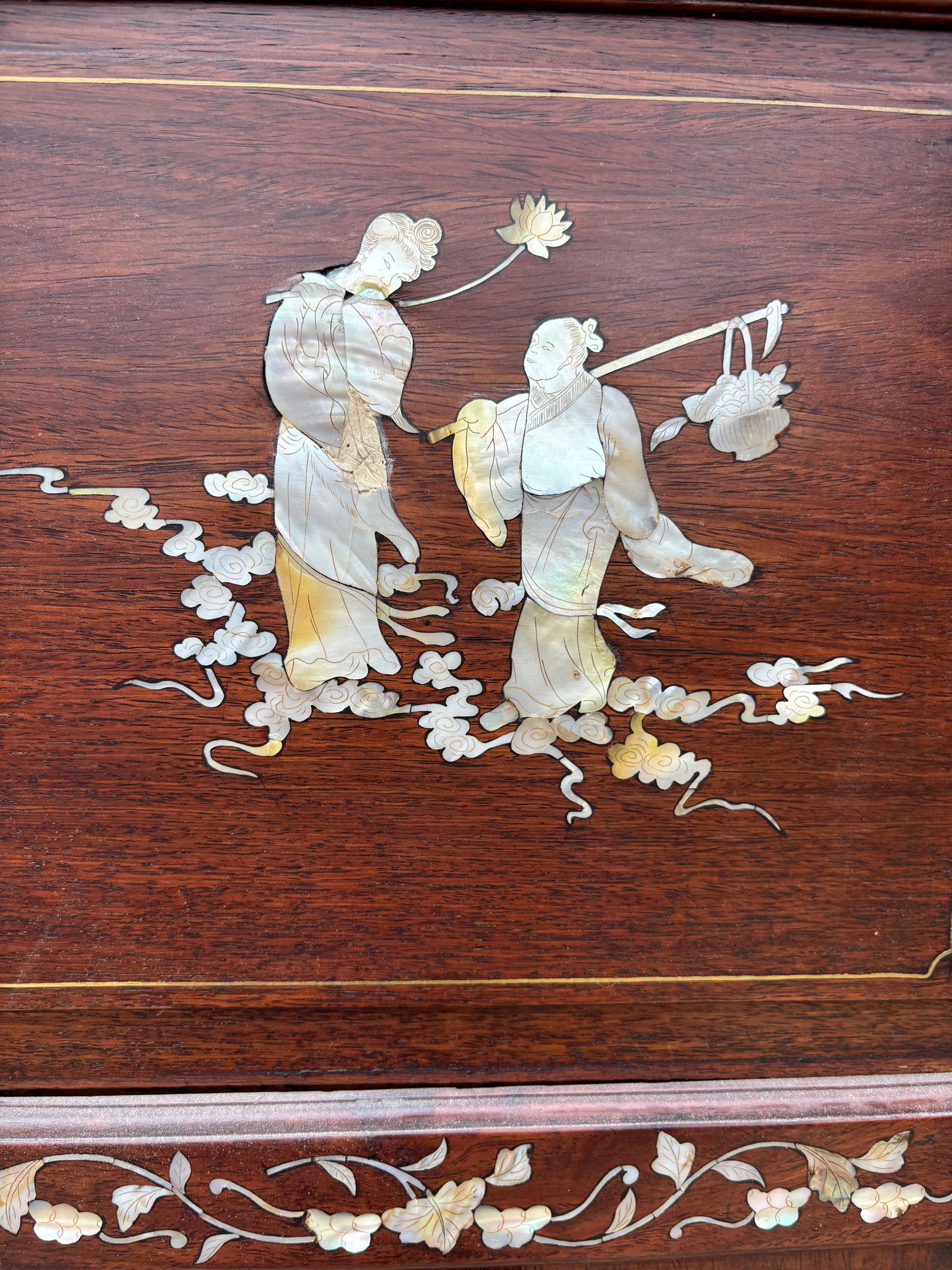 A Large Chinese Huanghuali/ rosewood Folding Screen with Mother-of-Pearl Inlay, 4 Panels: Qing Dynasty(1644-1912); An impressive Chinese folding screen, featuring four panels, each richly inlaid with mother-of-pearl decoration. The panels depict traditional figural scenes, landscapes, and