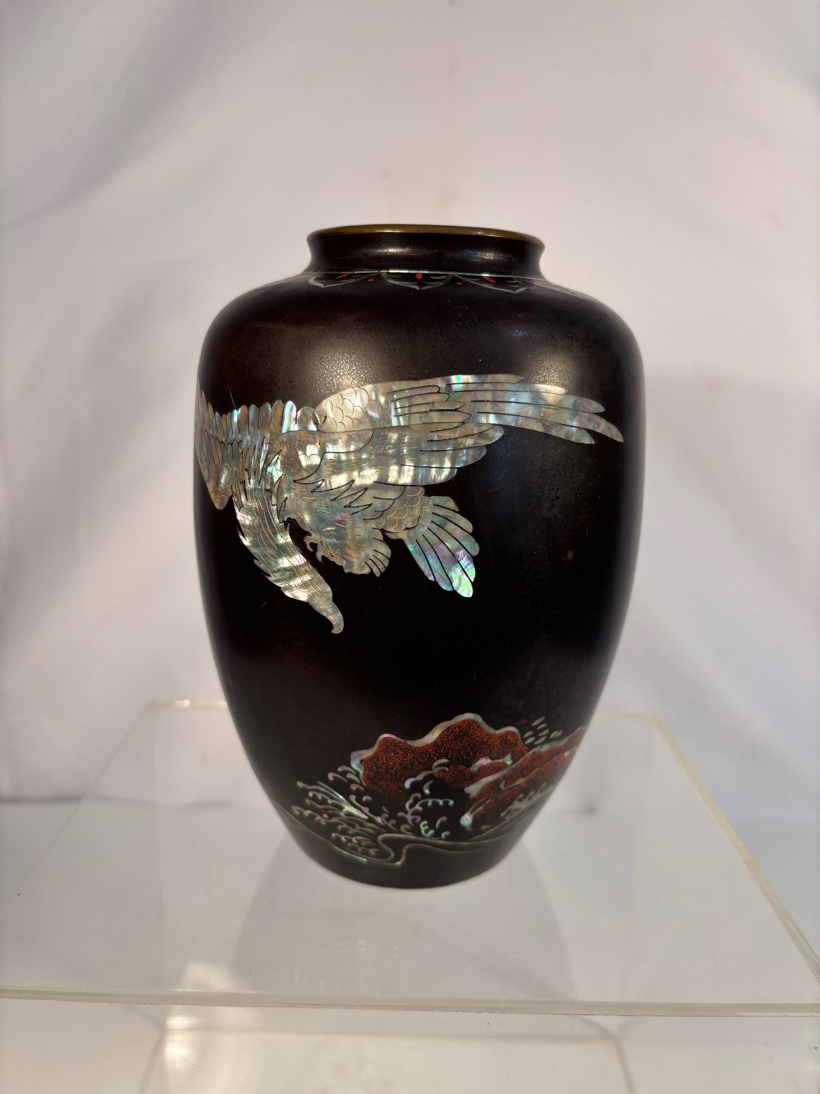 A Korean Lacquered Bronze Vase with Mother-of-Pearl Inlay, “In Memory of Korea,: Early - mid 20th century; Of ovoid form with short neck and flared mouth, the bronze body finished in dark brown lacquer and delicately inlaid with iridescent mother-of-pearl (nacre) depicting a flyin
