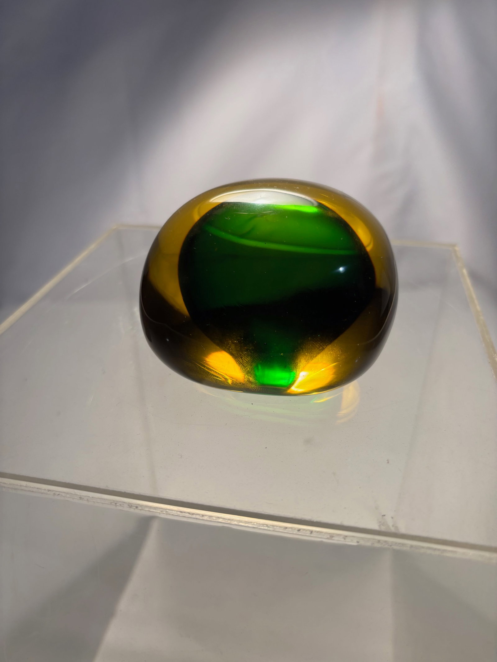 Murano Sommerso Amber & Green Art Glass Paperweight, Italy: Italian Murano art glass paperweight featuring a striking sommerso design with a deep emerald green core encased within a thick amber glass body. The organic, softly squared form creates dramatic ligh