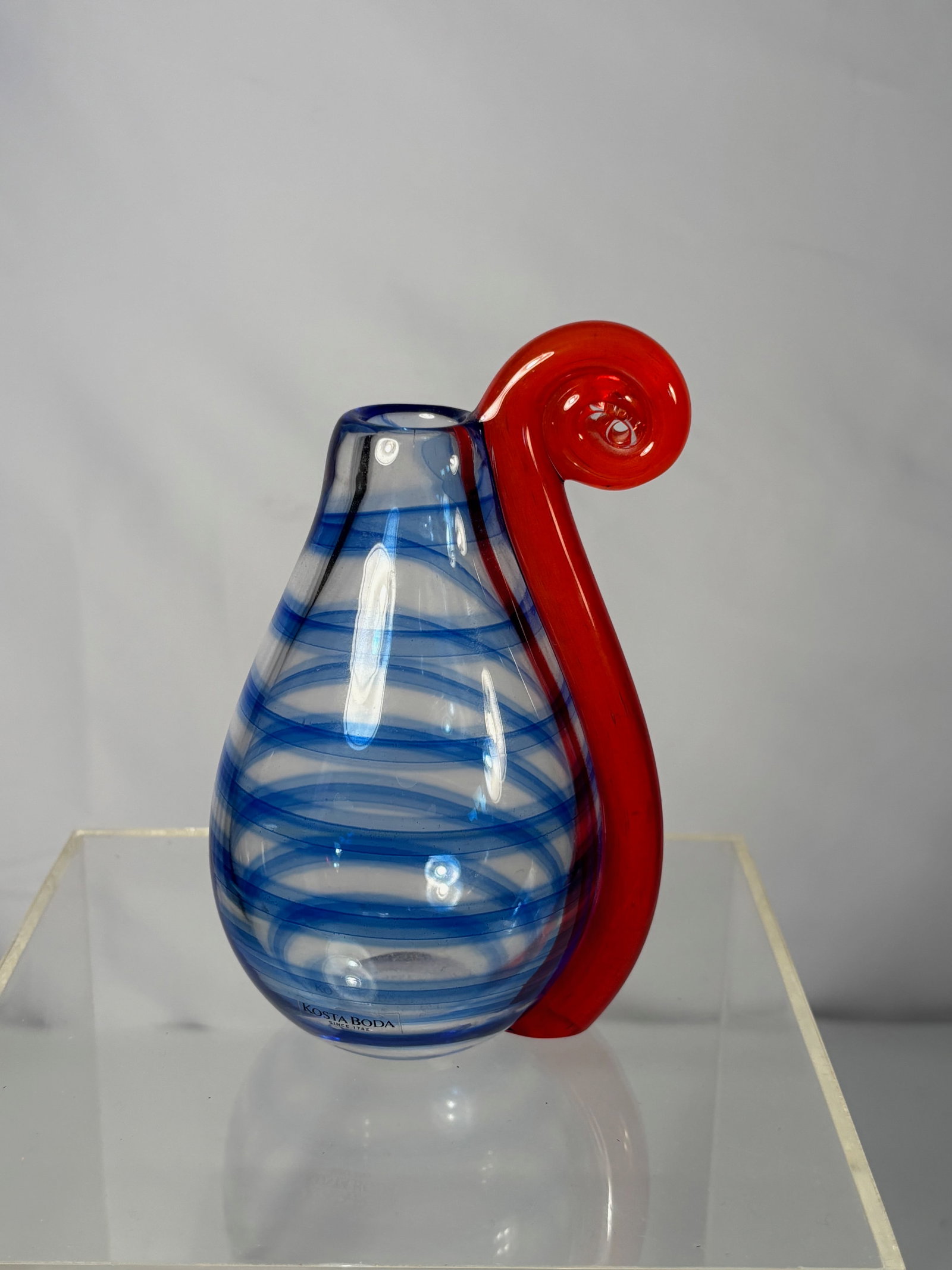 Ann Wåhlström(Sweden b. 1957) for Kosta Boda Atelier, Cirkusprinsessan Art Glass Vase, Limited: A hand-blown Swedish art glass vase from Ann Wåhlström’s Cirkus series for Kosta Boda Atelier, titled Cirkusprinsessan (Circus Princess), 1996. Featuring spiraling cobalt-blue bands and an applied