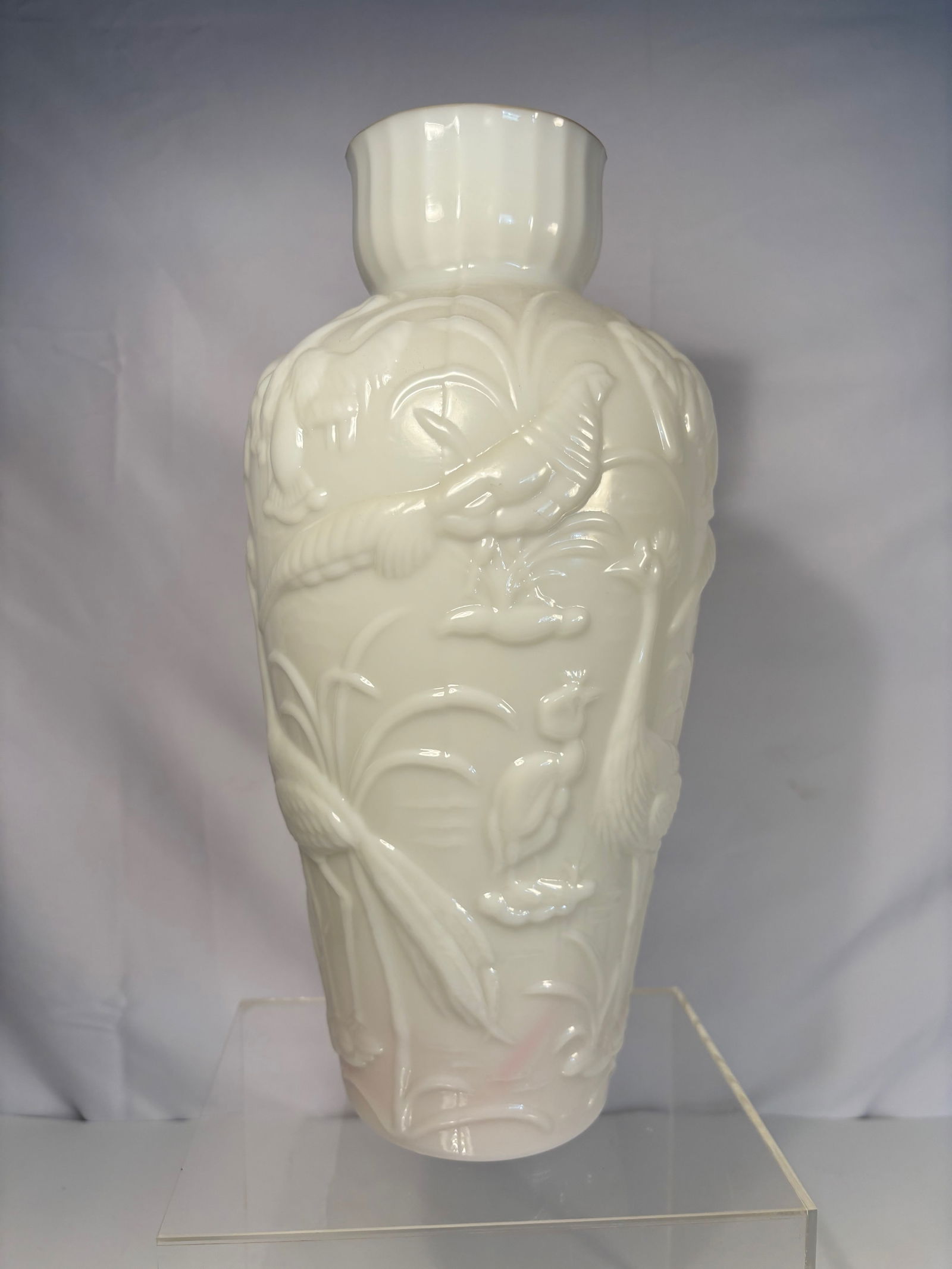 Vintage Gillinder Milk Glass Vase with Bird & Foliage Relief, Embossed Mark: A vintage pressed milk glass vase by Gillinder Glass Company, USA, mid-20th century. The baluster form molded in high relief with birds and foliage, rising to a flared rim. Molded “Gillinder”