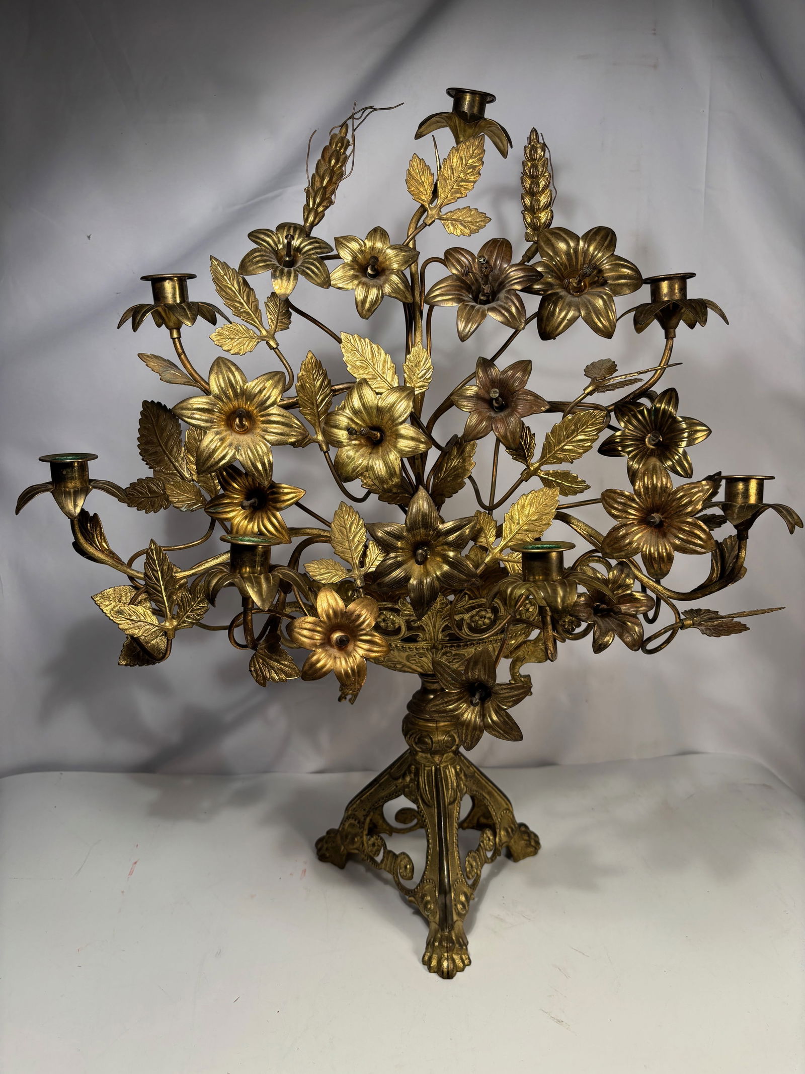 French Gilt Bronze (Ormolu) Seven-Light Floral Candelabrum, Napoleon III Period, 19th Century: A finely cast French gilt bronze (ormolu) seven-light candelabrum, Napoleon III / Second Empire period, circa 1860–1880. The central basket-form body is richly decorated with scrolling acanthus, bea