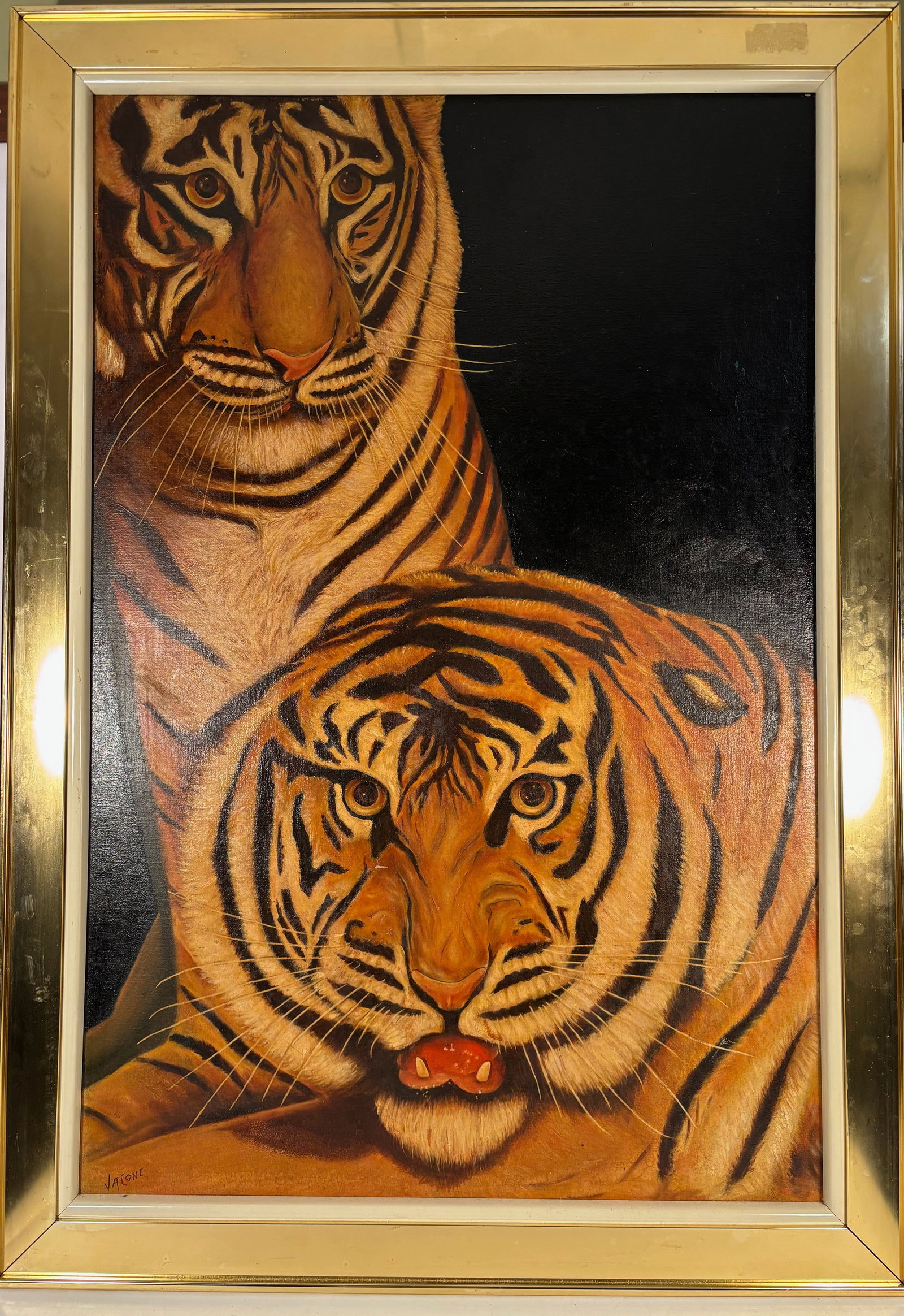 A Large Wildlife Tiger Oil Painting Signed “Jacone?? 29 x 41 in: Large wildlife painting depicting two tigers in a striking portrait composition. The work features vivid coloration and detailed rendering of the tiger fur against a dark background. The work features