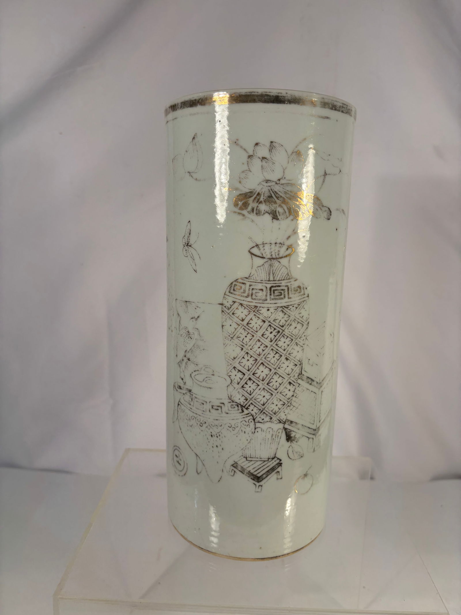 A Chinese Porcelain Hat Stand with Scholar’s Objects Motif: Qing dynasty(1644-1912) ,A Chinese porcelain hat stand, late Qing to Republic period, of tapering cylindrical form. The body is finely decorated in monochrome grisaille-style enamels with a refined sc