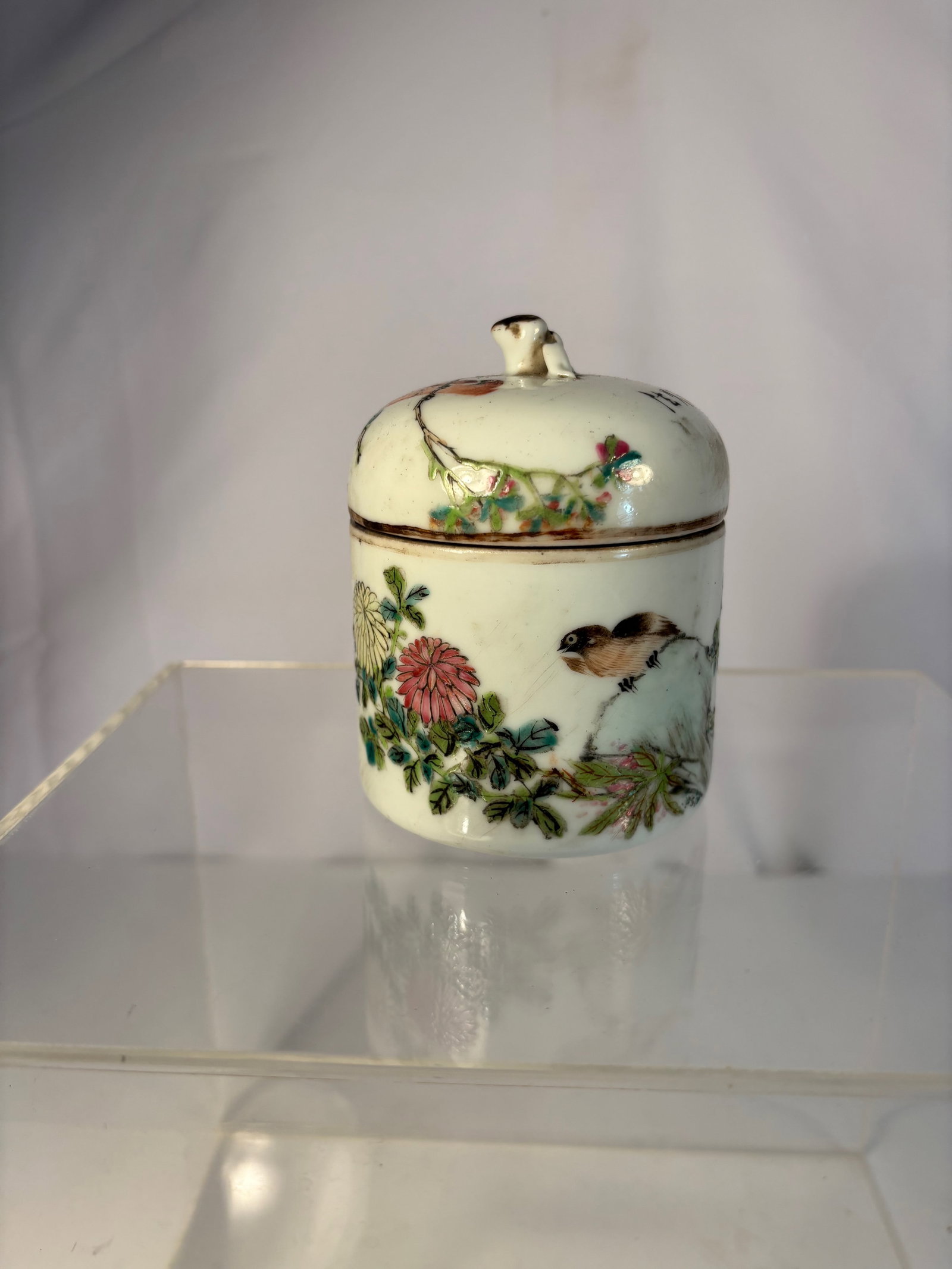 A Chinese Qianjiang Enamel Porcelain Covered Jar signed" YuanMao": Late Qing to early Republic period (circa 1880–1910), finely painted in pale famille-rose enamels with a bird perched among chrysanthemums, the reverse inscribed with a poetic verse and artist name,