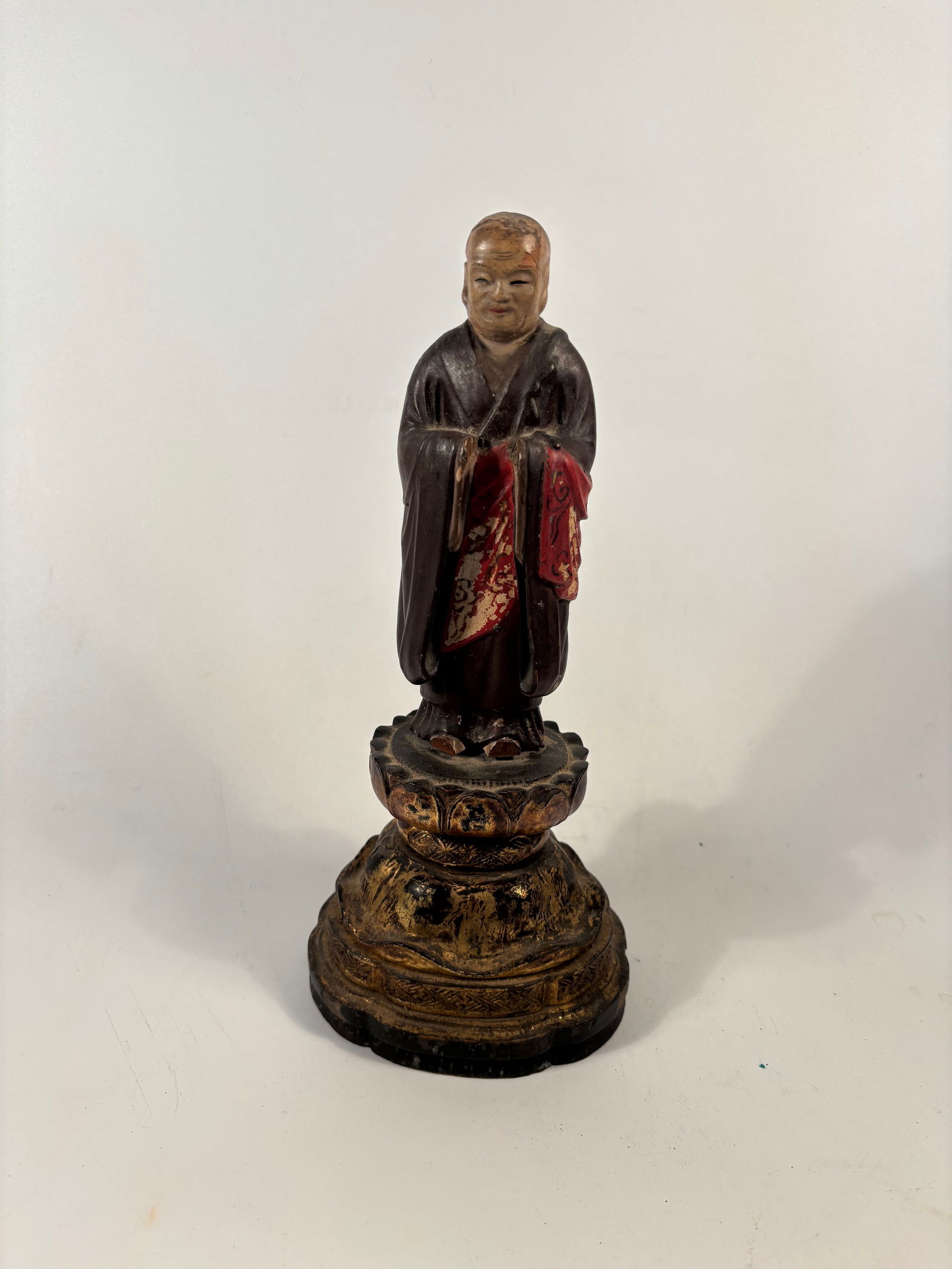 A Chinese Polychrome Wood Figure of a Buddhist Monk – c. 1850.: 19th century, A finely carved and painted Chinese wooden figure of a Buddhist monk, dating to the mid-19th century (circa 1850, Qing Dynasty). The figure stands with hands joined in front of the chest