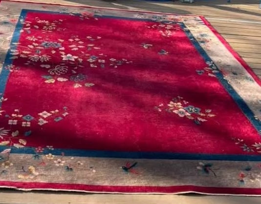 Vintage Chinese Hand-Knotted Wool Rug, Red Field with Floral Sprays ,9 feet x 11 feet: Vintage Chinese hand-knotted wool rug featuring a rich red field decorated with scattered floral sprays, framed by a contrasting blue inner border and wide neutral guard border. Size: 9 feet x 11 feet