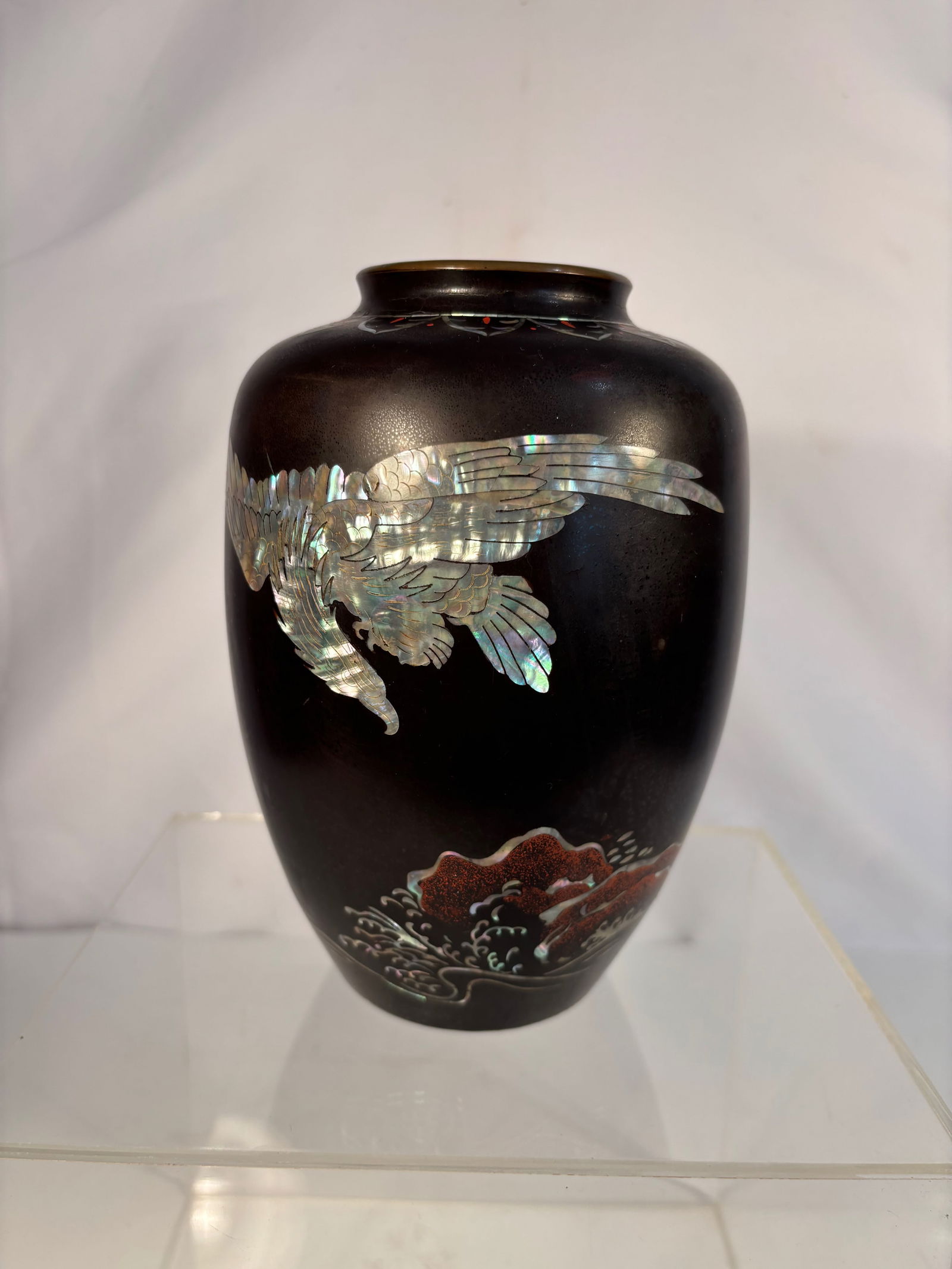 A Korean Lacquered Bronze Vase with Mother-of-Pearl Inlay, “In Memory of Korea,: Early - mid 20th century; Of ovoid form with short neck and flared mouth, the bronze body finished in dark brown lacquer and delicately inlaid with iridescent mother-of-pearl (nacre) depicting a flyin