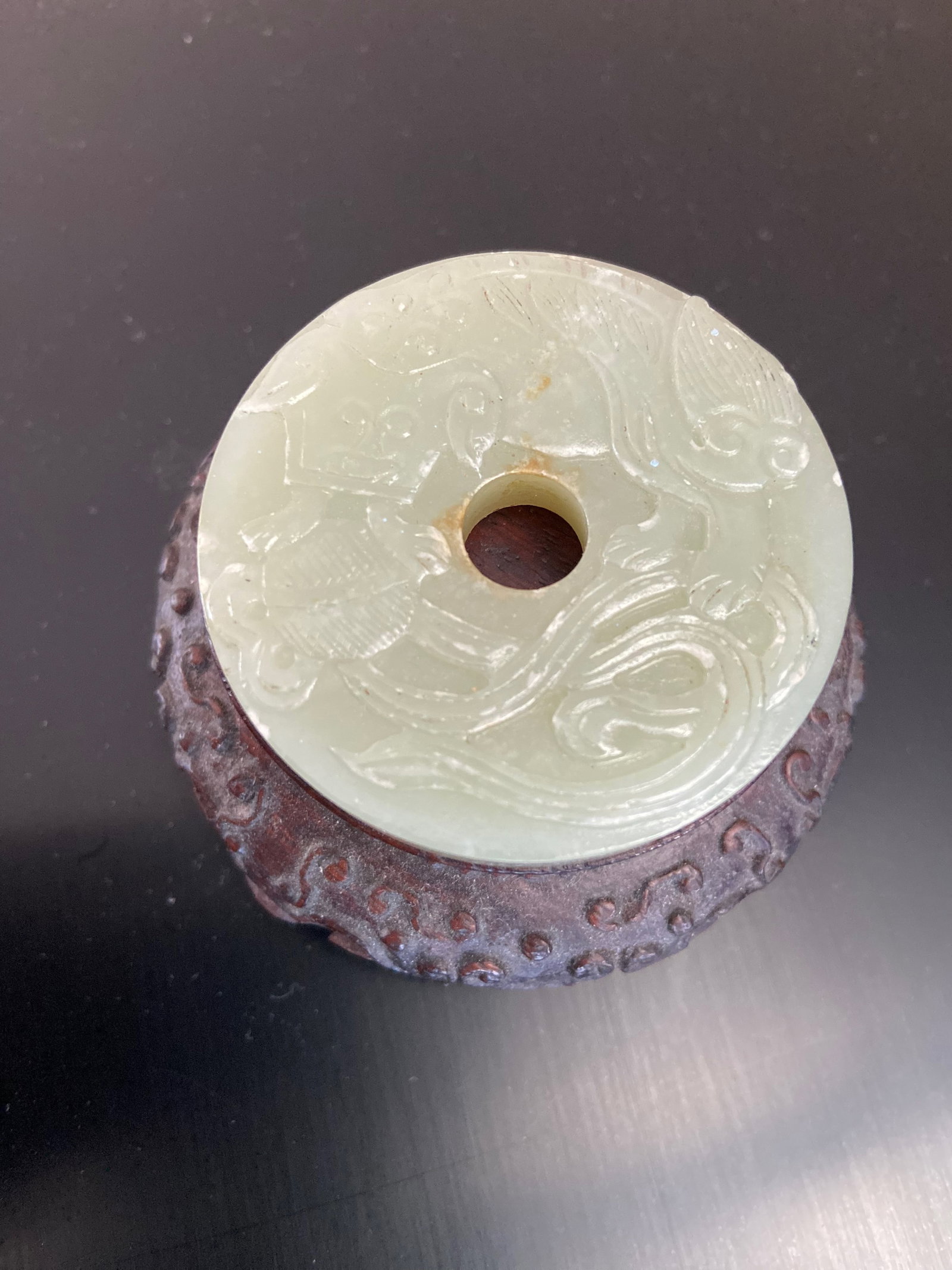 A Chinese nephrite jade round plaque: Qing Dynasty (1644-1912);This jade is two side carved . Dimensions?Diameter : 5 cm/ 2 inches