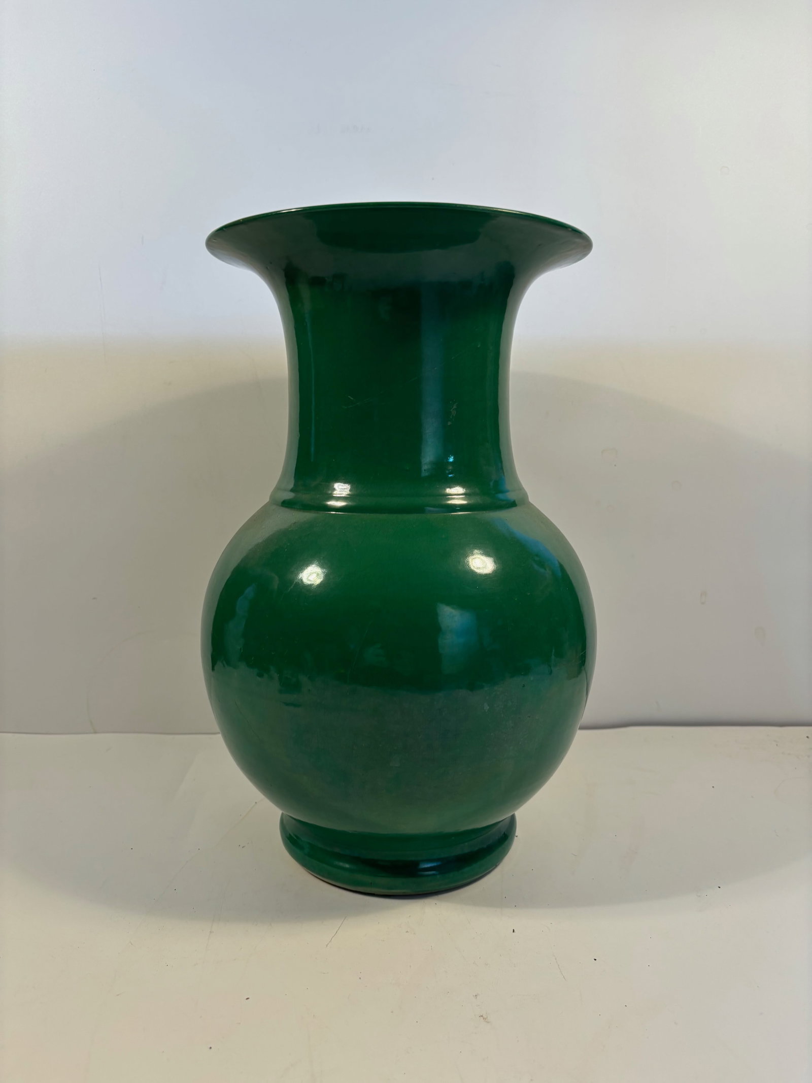 A Chinese emerald green monochrome glaze Gu form vase Ming Dynasty: Dated: Ming Dynasty (1368-1644); Christie’s auction house (auction lot number 316).Dimensions?Height: 14 inches.