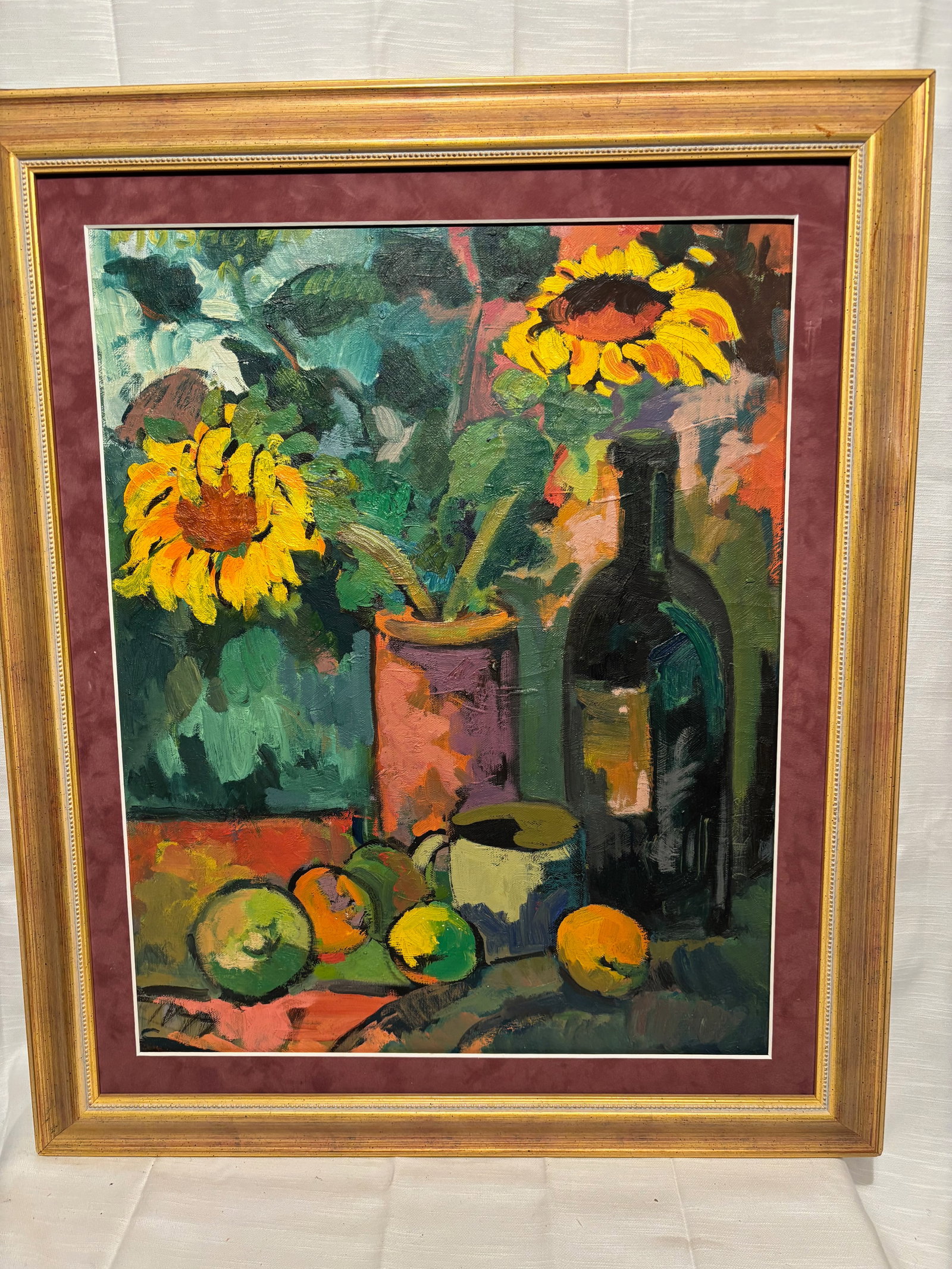 Signed Contemporary Expressionist Sunflower Still Life Oil on Canvas: Signed contemporary expressionist still life depicting vibrant sunflowers in a vase with fruit, cup, and dark glass bottle. Executed in bold, richly layered brushstrokes with vivid yellows, greens, tu