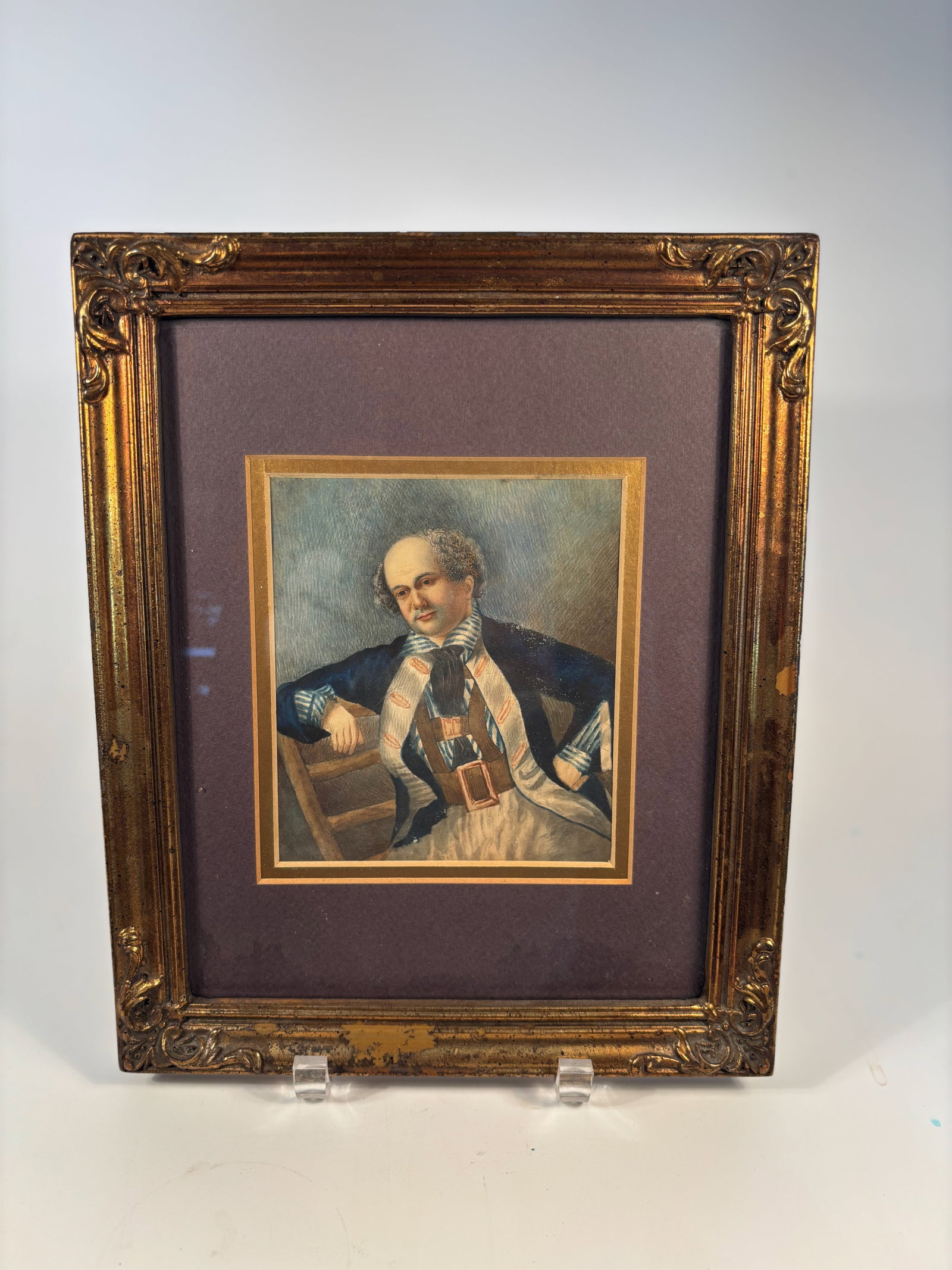 " Portrait of a Gentleman" Watercolor on Paper, 19th century: Likely painted circa 1830–1870, in the Romantic or early Victorian period.The subject’s attire—ruffled shirt, sash, and buckled waistcoat—suggests a late 18th-century or early 19th-century gen