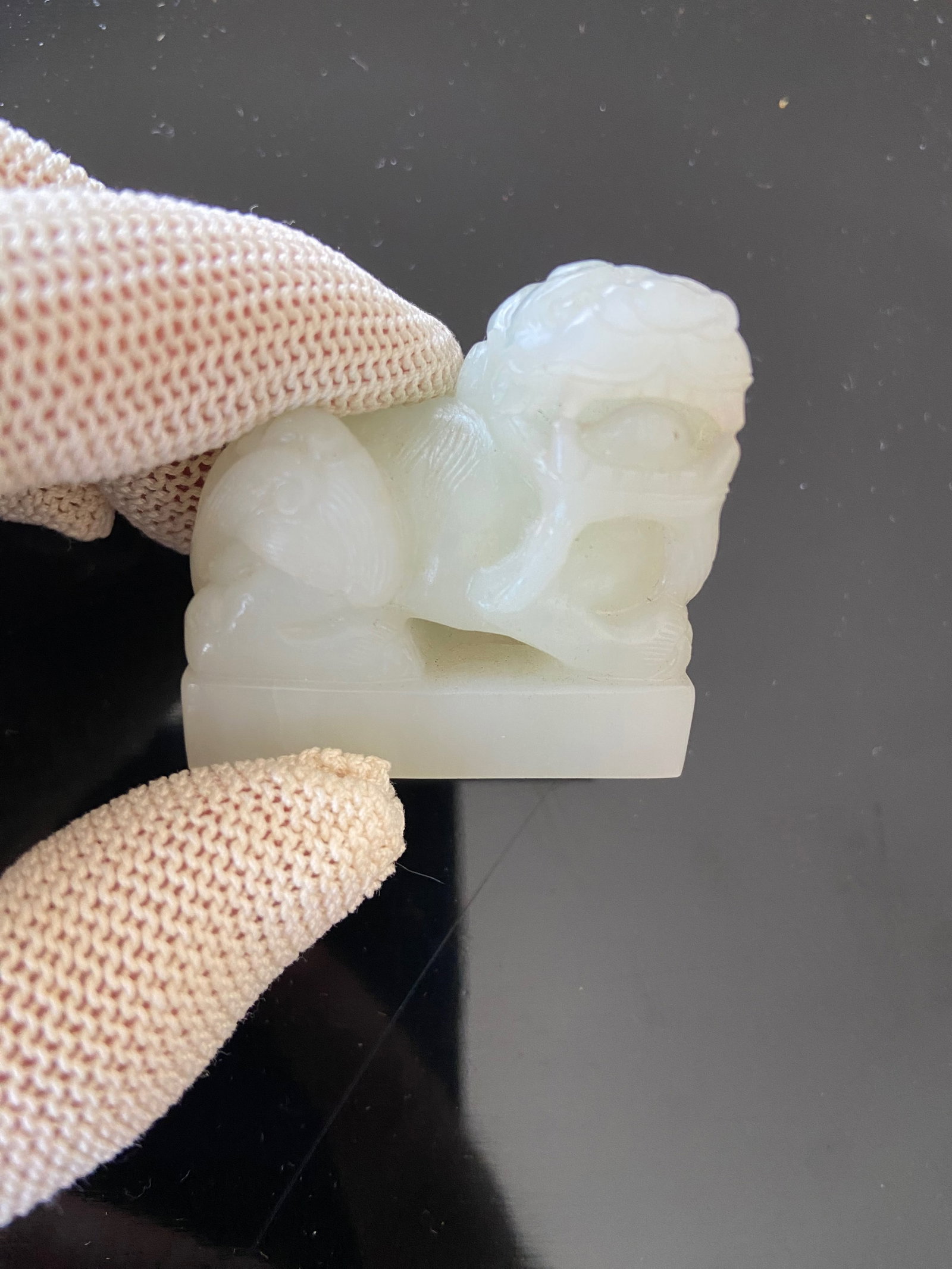 A Chinese nephrite white jade foo dog: Qing Dynasty (1644-1912); This nephrite White jade foo dog has High-value carvings which typically have a smooth, polished finish . Dimensions?Length:4 cm , height: 3.5 cm