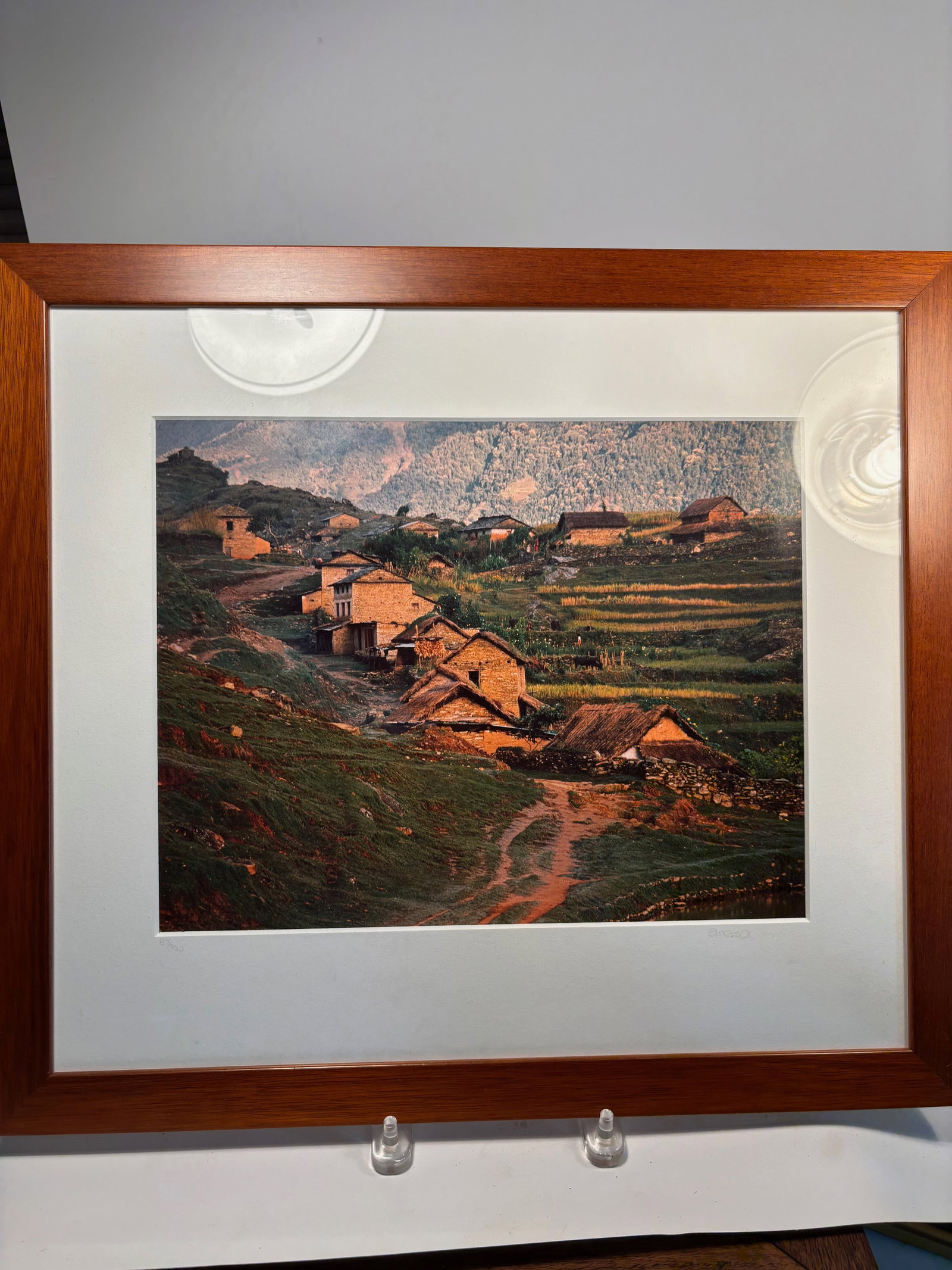 Emerson Matabele (American, b. 1950) – “Himalayan Impression, Kabre, Nepal??, 1983, Signed: Color photograph by Emerson Matabele, titled “Himalayan Impression”, taken in 1983 in Kabre, Nepal. Presented in its original mat and wooden frame. Hand-labeled and signed by the artist on