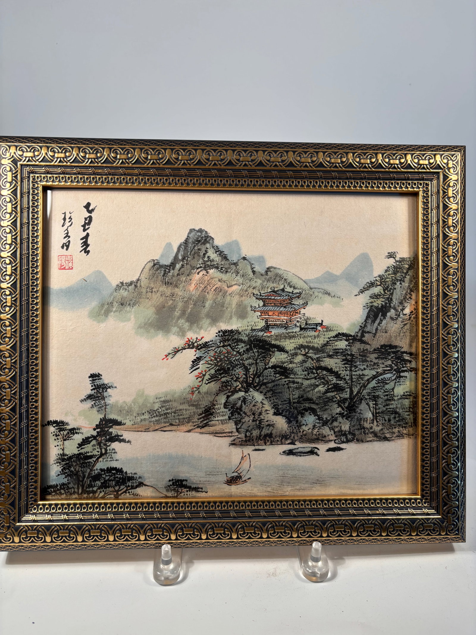 A Chinese Landscape Water Color Painting signed by artist "GU YU YANG": A finely detailed Chinese landscape painting; as signed and sealed on the upper left. Executed in ink and delicate color on silk, the artwork depicts a serene mountainous riverscape with traditional p