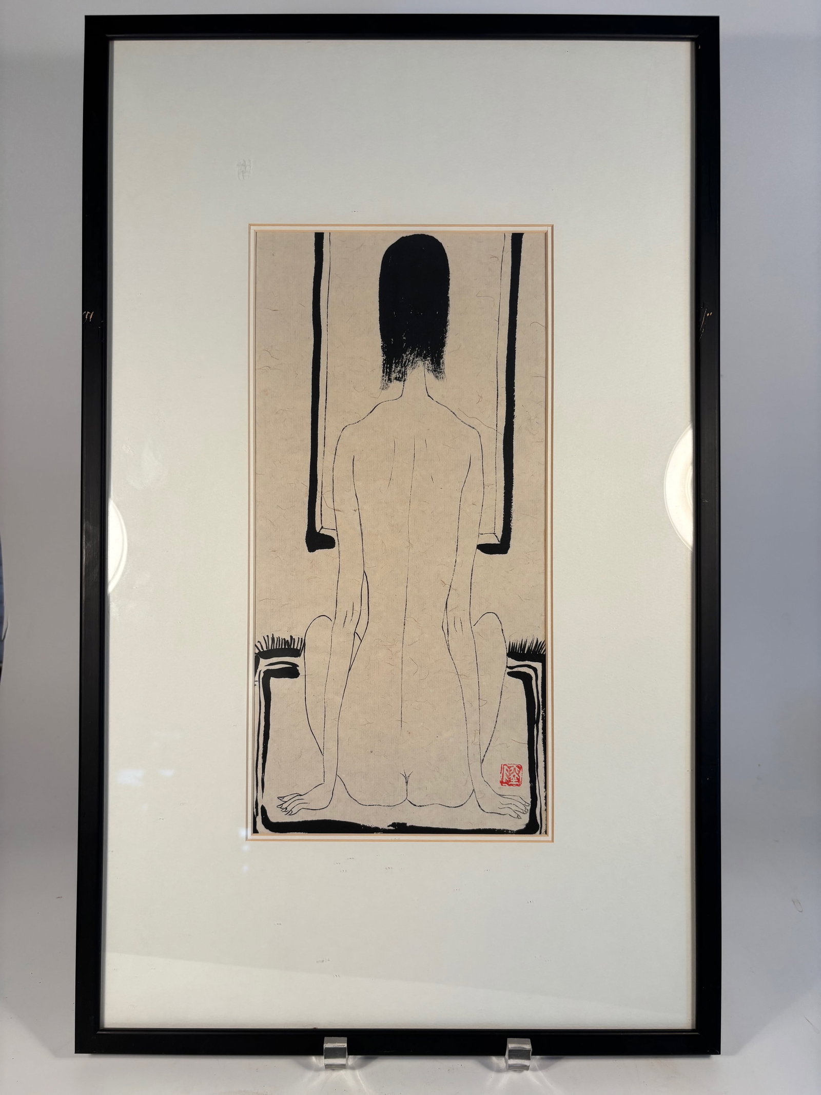 A Chinese Ink Painting of a Seated Nude Woman with Seal Mark "LU": Ink on paper, depicting a stylized nude woman seated with her back turned, rendered in minimalist black lines with subtle shading. The composition is framed by geometric window forms, evoking a contem