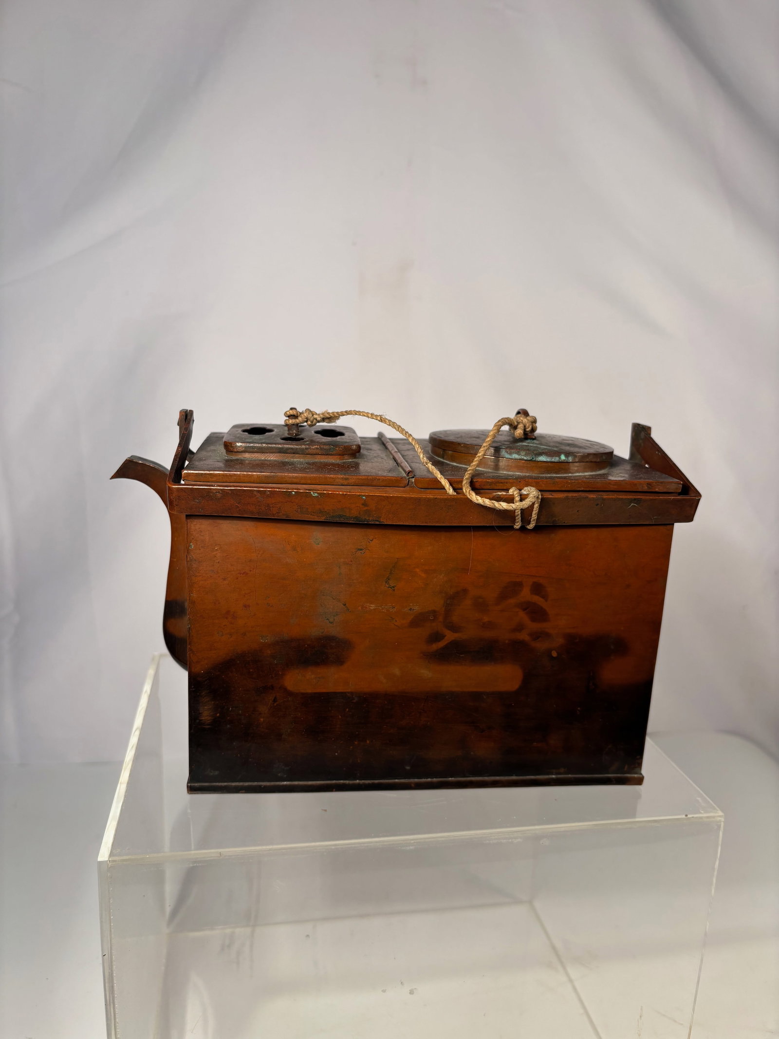 Japanese Meiji Copper Sake Warmer (Kan-d?ko) with Dual Lids and Handle: Meiji period (circa 1880–1910),A Japanese copper sake warmer (kan-d?ko), rectangular in form with angular spout and upright swing handle, the top fitted with two circular lids—one vented and one s