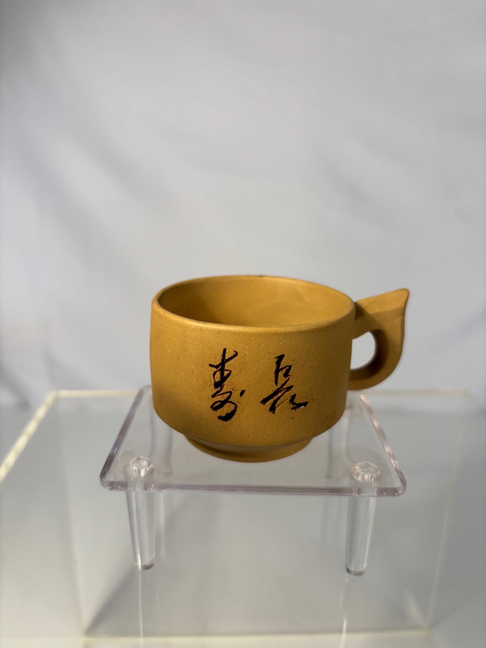 A Chinese Yixing Yellow Clay Teacup with Calligraphy, Signed Zhou Guizhen: 20TH Century ; ?Dimensions?Length: 3.25 inches , height: 2 inches.