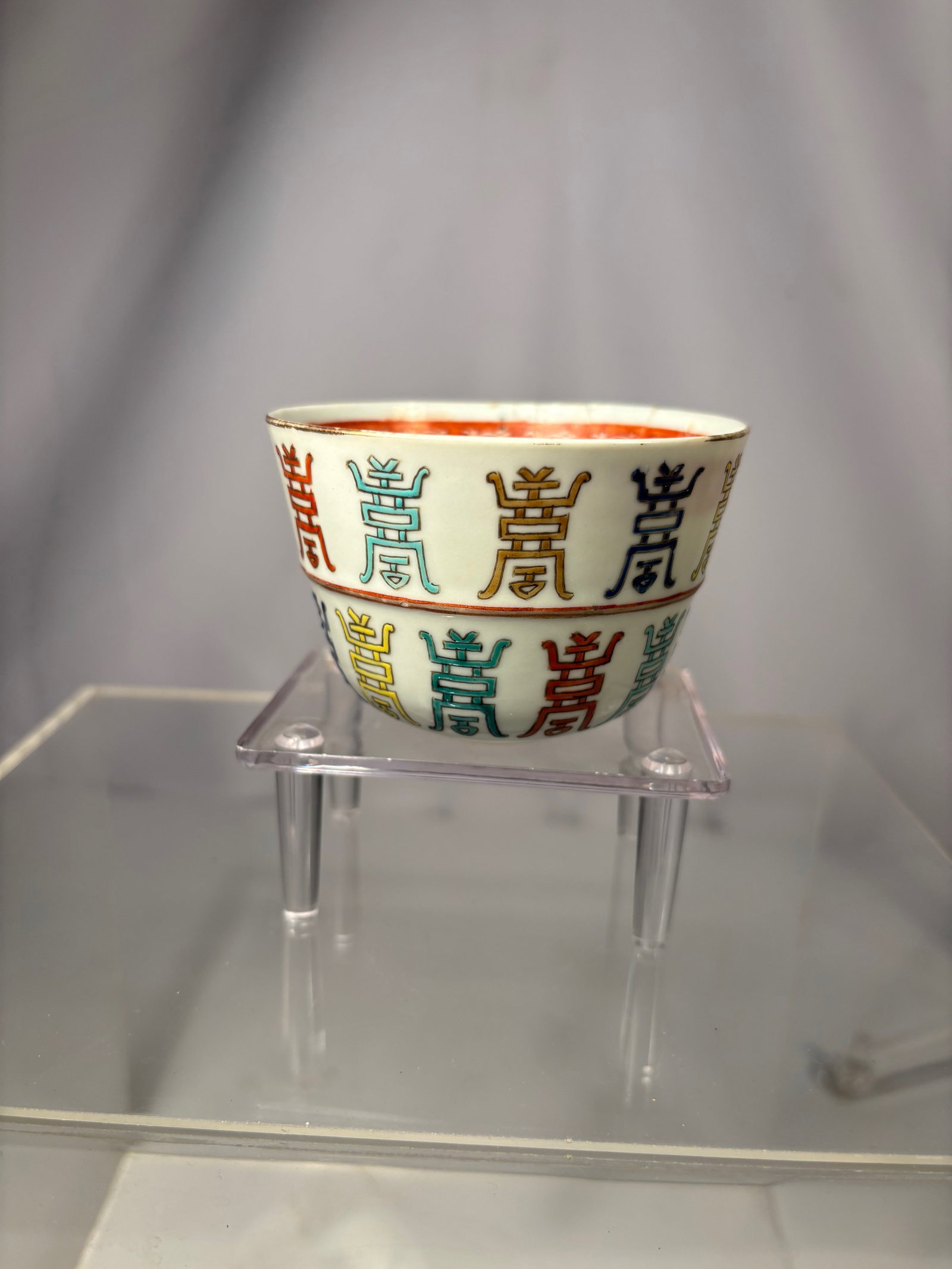 A Chinese Famille-Rose Porcelain Bowl with Multicolor Shou Characters, Guangxu Mark and Period: Guangxu Mark and Period (1875–1908);The deep rounded sides rising from a short foot to a slightly everted rim, the exterior finely enamelled in bright famille-rose enamels with rows of large stylize