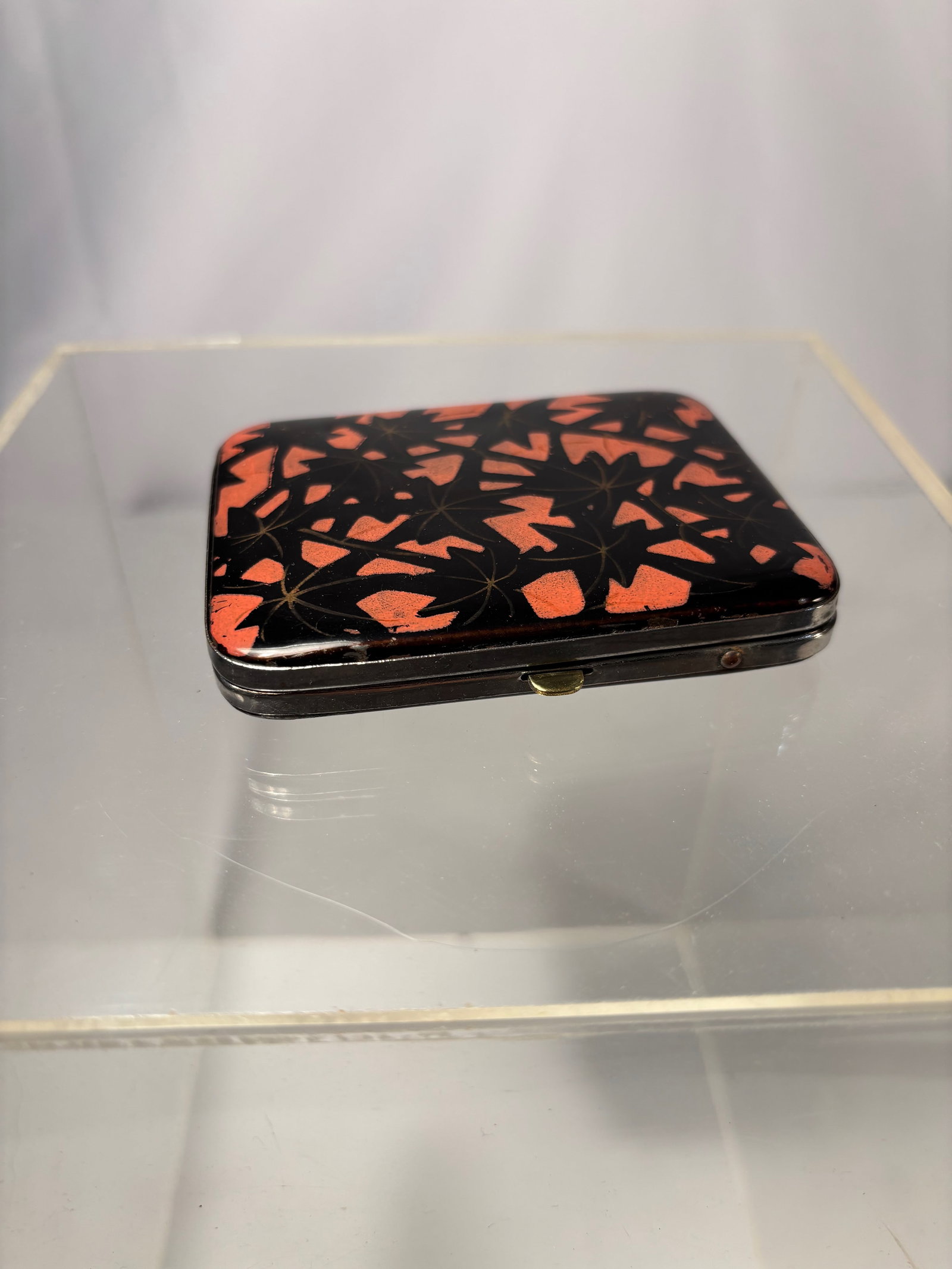 A Japanese Lacquered Inr?-Style Personal Case, Meiji Period: A Japanese lacquered personal case of compact rectangular form, likely dating to the Meiji period. Finished in a deep black lacquer with a smooth, polished surface, the case opens to a fitted interior