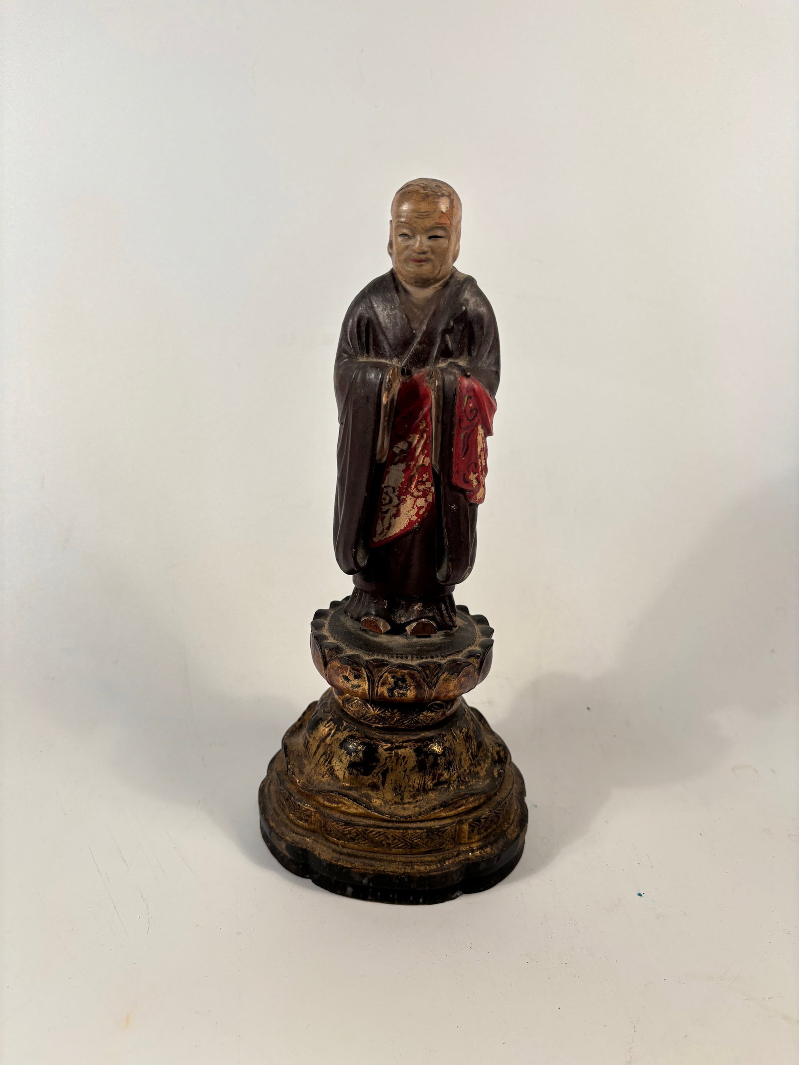A Chinese Polychrome Wood Figure of a Buddhist Monk – c. 1850.: 19th century, A finely carved and painted Chinese wooden figure of a Buddhist monk, dating to the mid-19th century (circa 1850, Qing Dynasty). The figure stands with hands joined in front of the chest