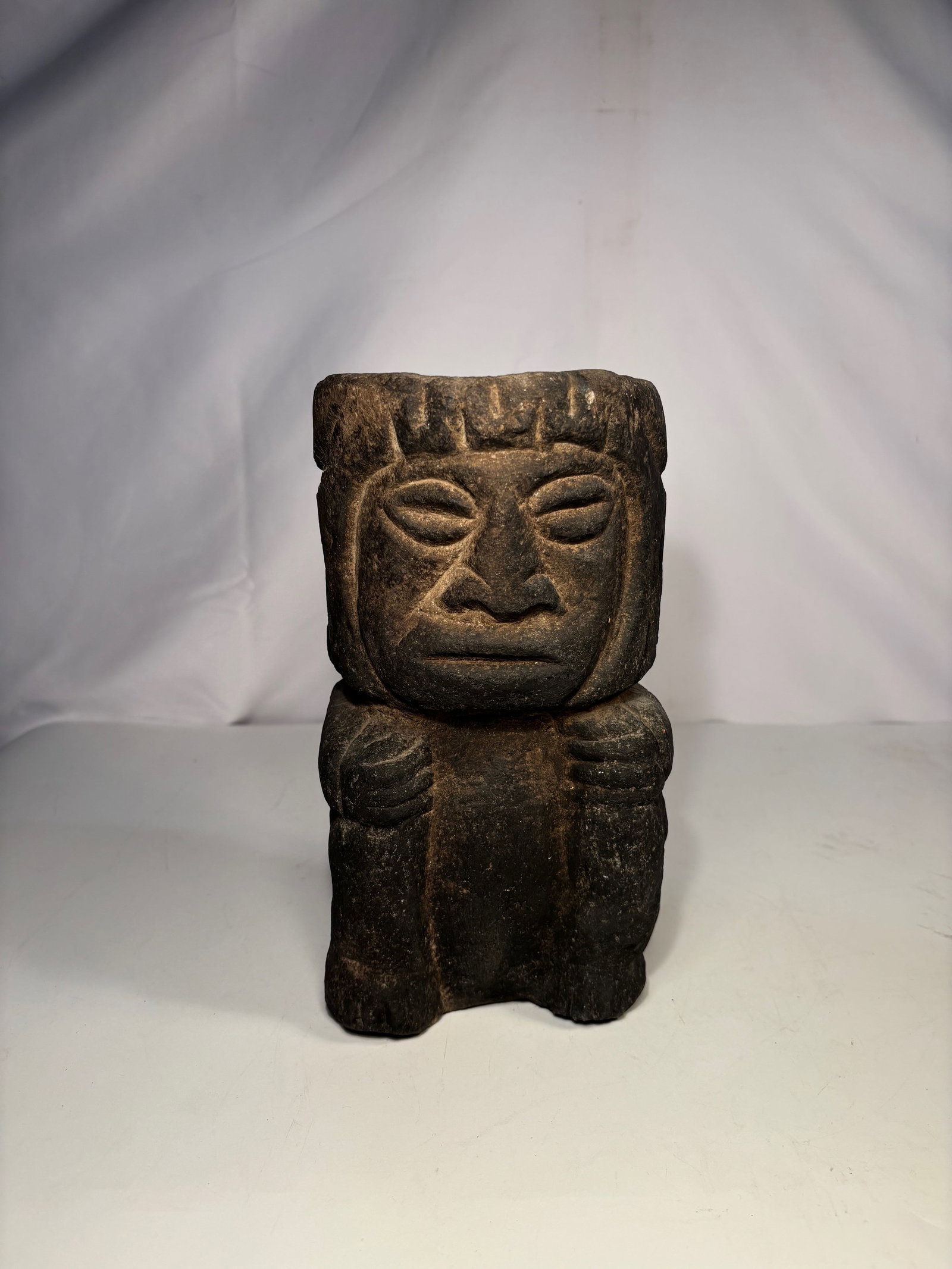 A Carved Stone Standing Figure, Possibly Pre-Columbian: Pre-Columbian style stone figure, in the manner of the Teotihuacan culture of the Valley of Mexico. The standing figure is hand-carved from stone, possibly a green stone, and features stylized proport