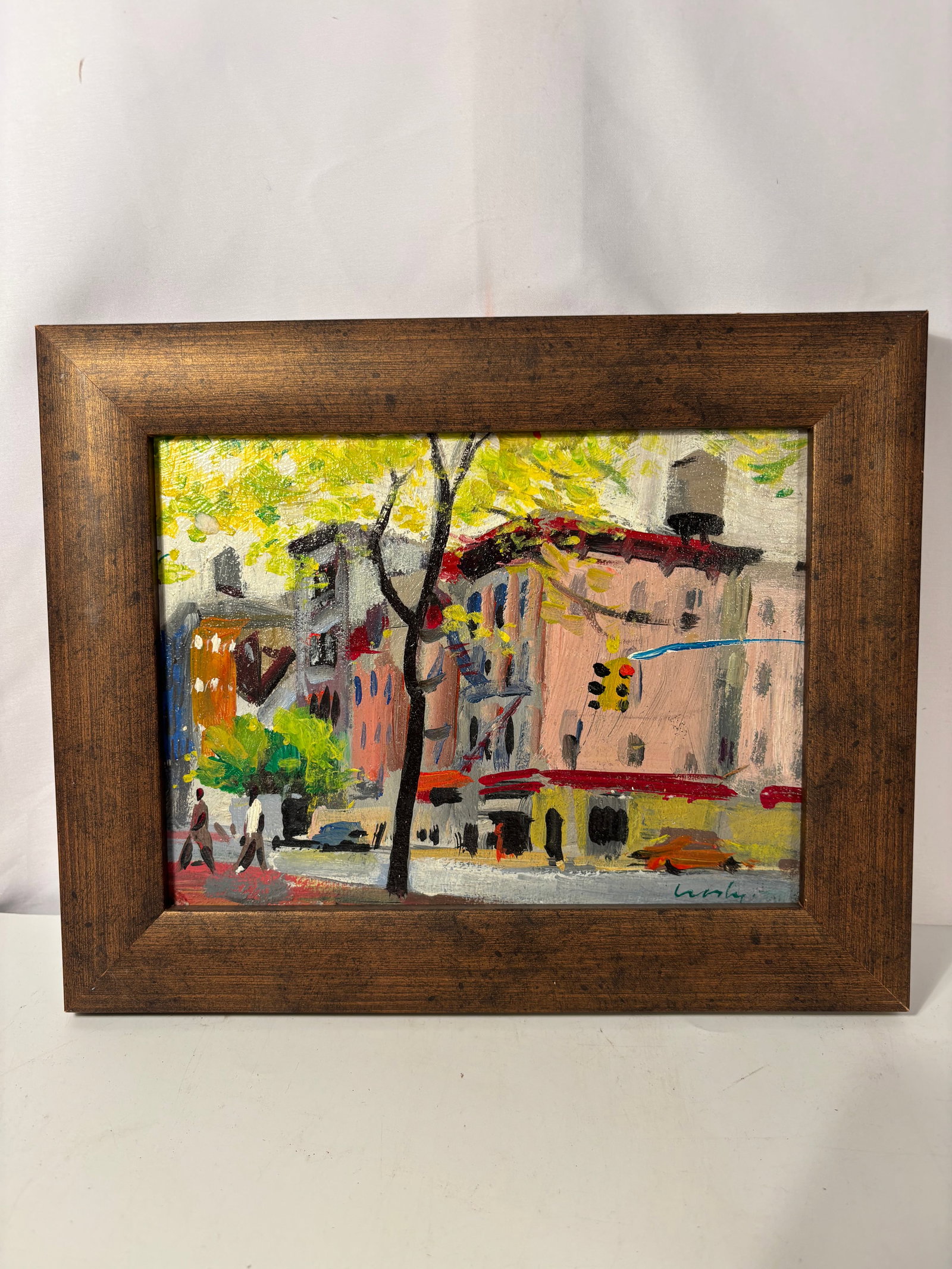 Mid-Century Impressionist New York City Street Scene Oil Painting Signed: A lively mid-century urban street scene oil painting, depicting a tree-lined city intersection with pedestrians, parked cars, and softly rendered apartment buildings. Executed in an expressive impress