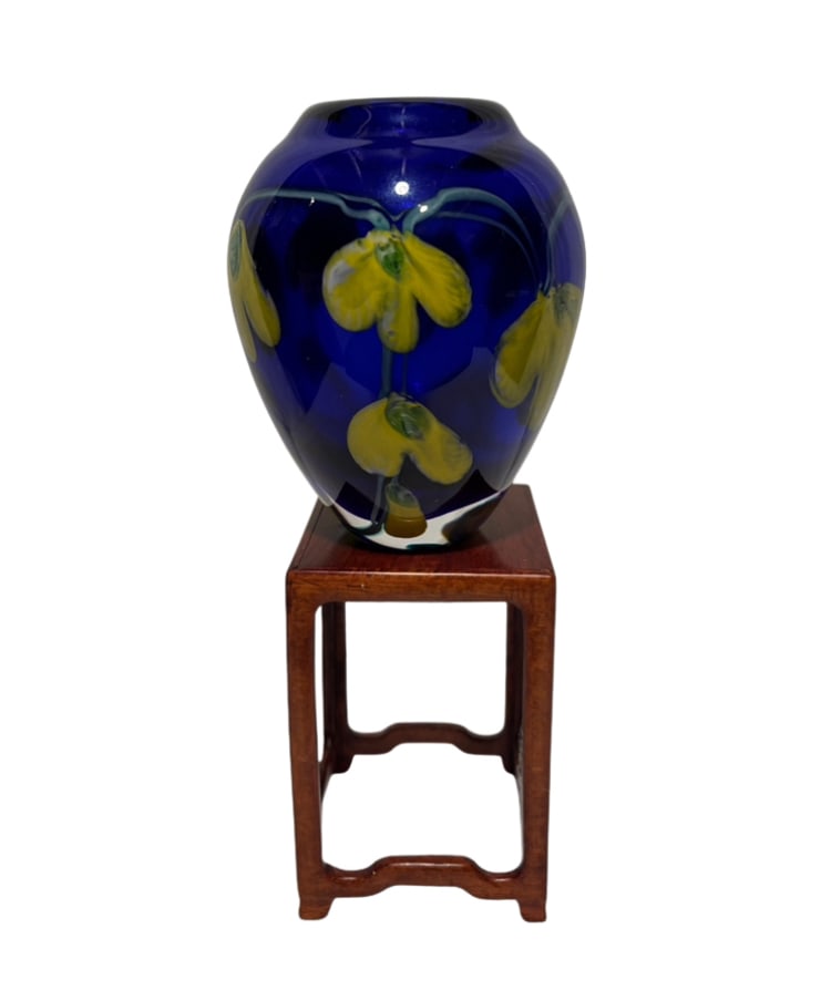 A Heavy Cobalt Blue Art Glass Vase w/ Yellow Floral Design, Hand Blown: A heavy studio art glass vase featuring a deep cobalt blue ground with embedded yellow floral motifs. Solid and well-made, with a smooth polished base. Likely hand-blown and contemporary studio work. 