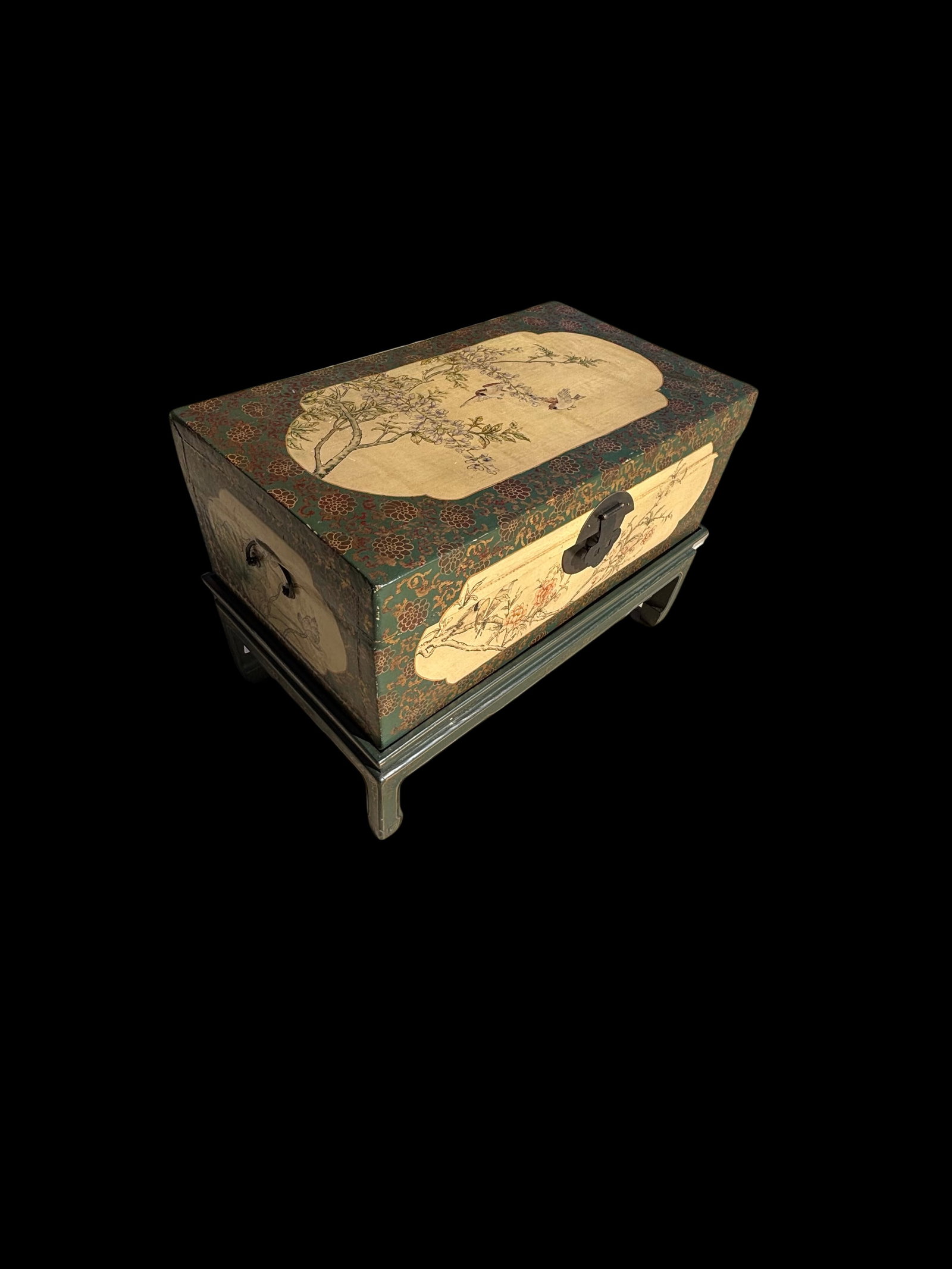 19th Century Chinese Export Painted Leather Trunk: The exterior is finished in a deep green lacquer ground with gilt floral scroll decoration. Each side is inset with hand-painted panels depicting birds and floral motifs, executed in a delicate tradit