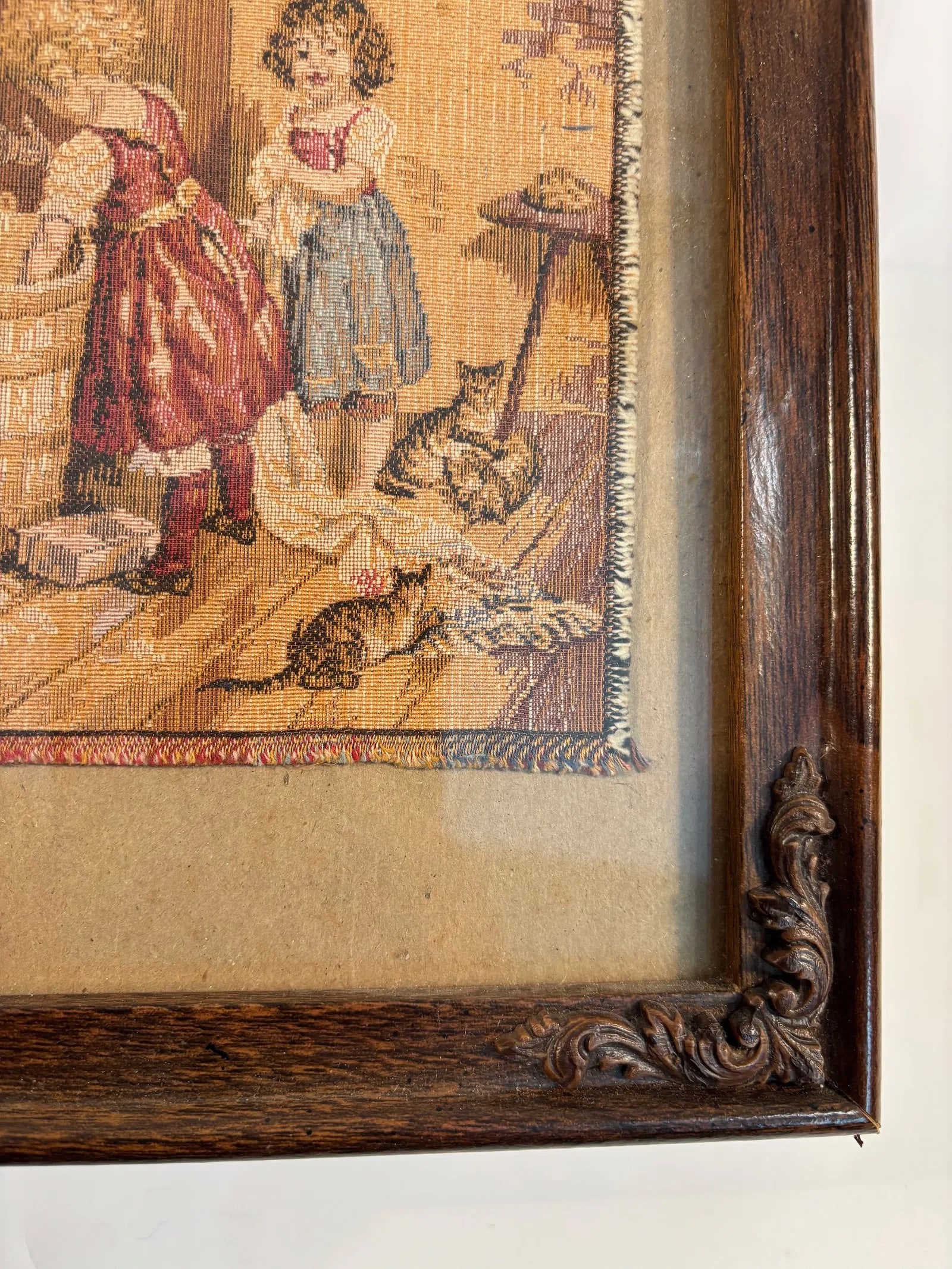 An European Needlepoint Tapestry “Children at the Wash Tub??, circa 1900–1930: A charming petit point needlework depicting two young girls beside a wooden wash tub, with a black cat perched on the rim and scattered household items around them. Executed with fine colored threads 