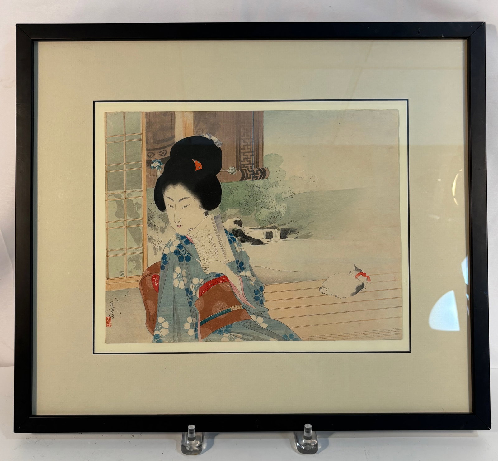 Mizuno Toshikata (1866–1908), A Seated Beauty with a Cat, Watercolor and Gouache on Paper, ca.: Depicting a young woman dressed in a blue kimono patterned with white blossoms, seated on a veranda while holding a fan. Behind her stands a sliding sh?ji screen, with a white cat resting leisurely ne