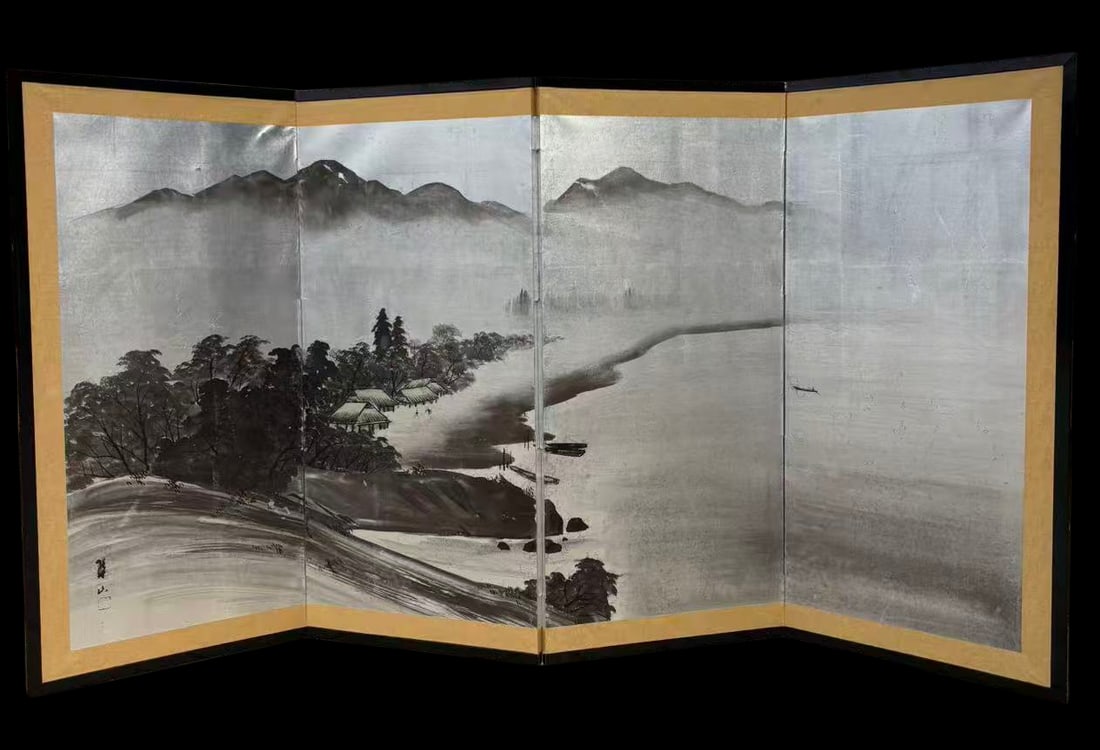 A Japanese Four-Panel Folding Screen, Ink Landscape, Signed “Suisan?? (??), Taish? Period: Japanese four-panel folding screen (by?bu), ink on paper, depicting an atmospheric river landscape with distant mountain ranges emerging through mist, clustered trees, village dwellings and boats alon