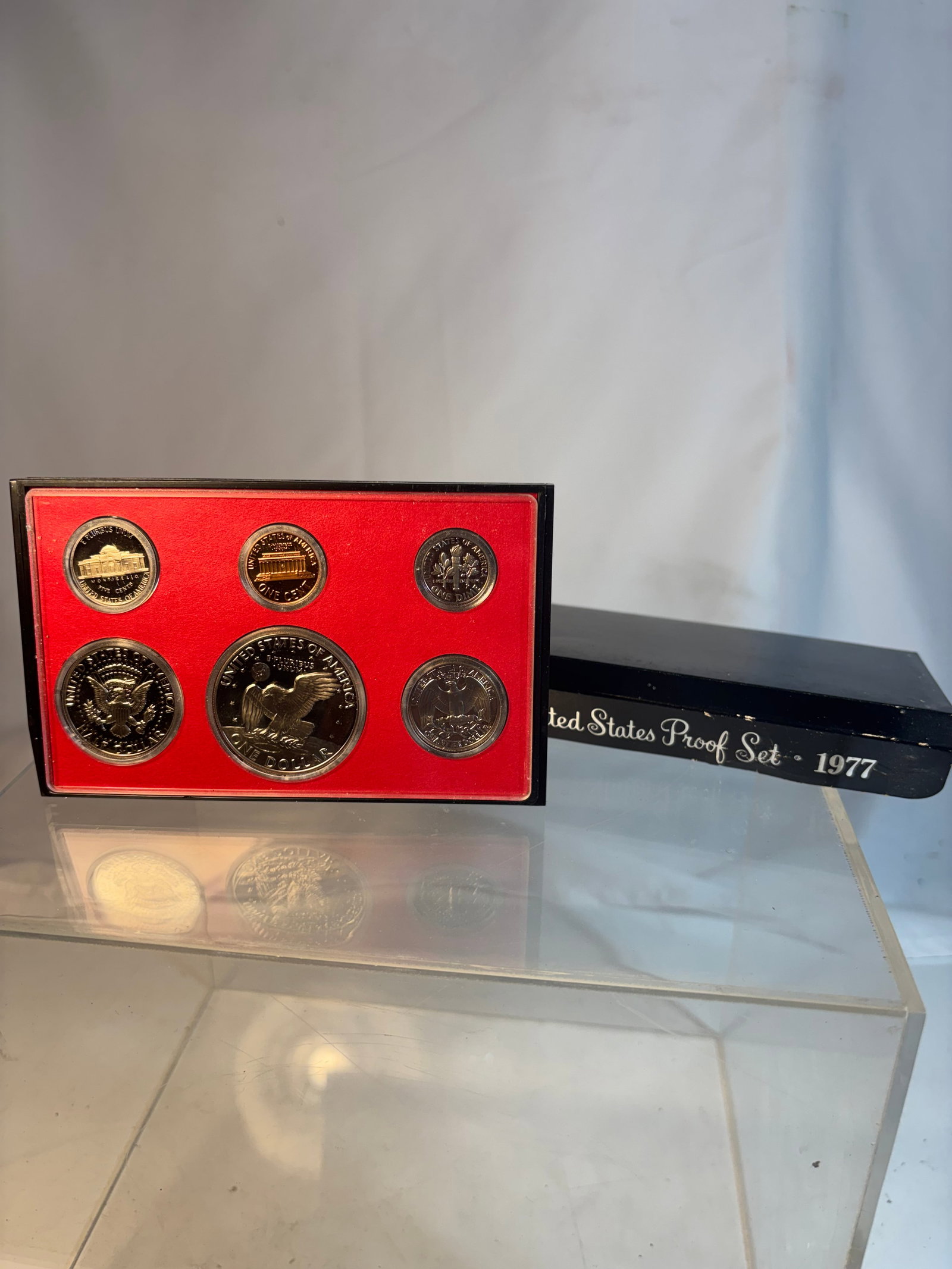 1977 United States Proof Set in Original Government Packaging: Official 1977 United States Proof Set issued by the U.S. Mint, including six proof strike coins housed in original government packaging and presentation case. Features mirror-like proof finishes with 
