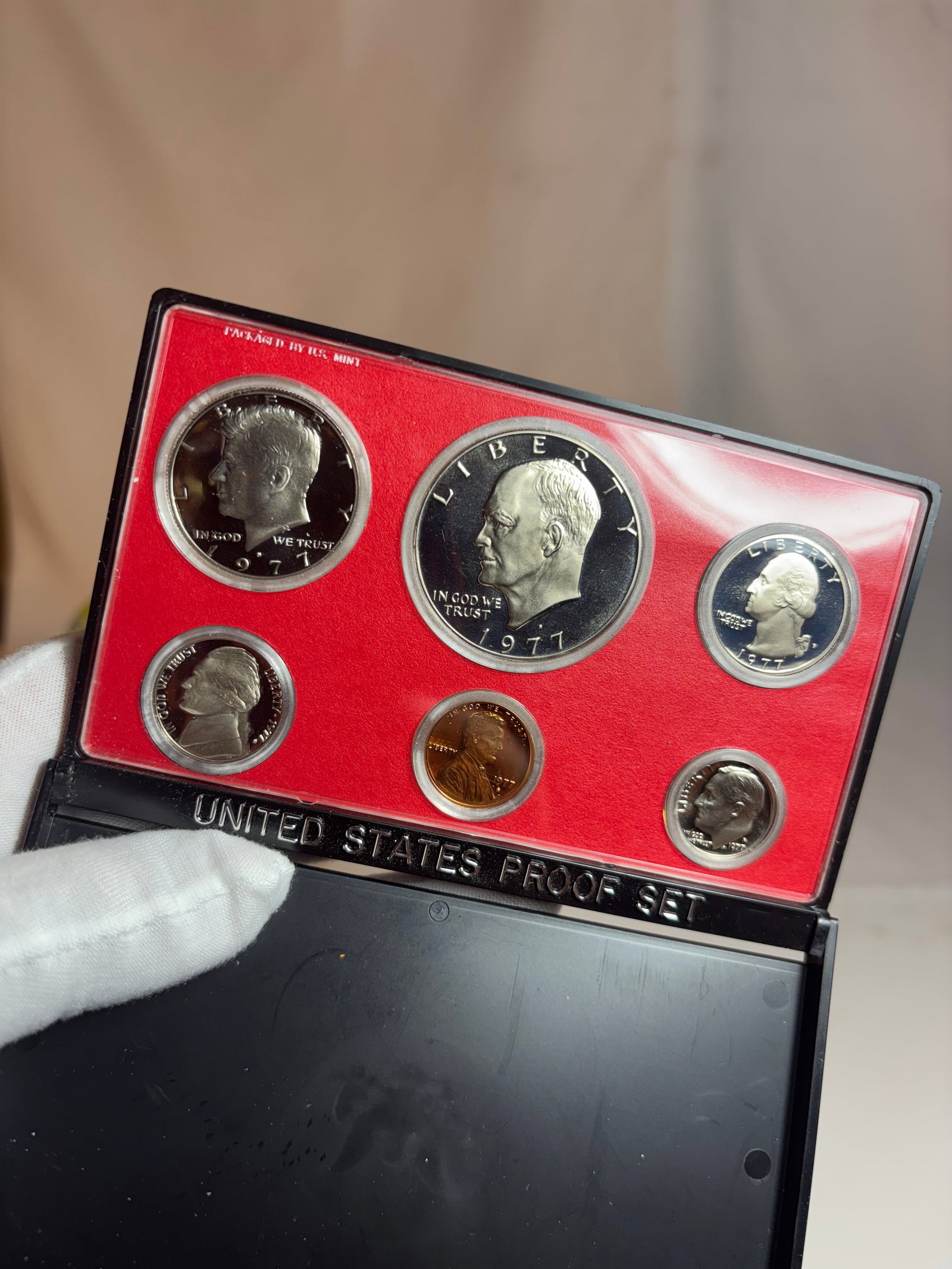 1982 United States Proof Set in Original Government Packaging: Official 1982 United States Proof Set issued by the U.S. Mint, including six proof strike coins displayed in original government packaging. Features mirror-like proof surfaces with frosted details, in