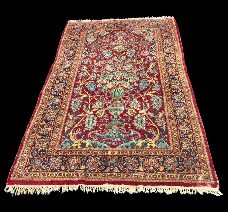 Fine Persian hand-knotted Vase Motif Floral Rug, Red Field, Intricate Design: Persian-style decorative rug featuring an elegant vase-and-floral motif set against a rich red field. The central composition displays a stylized urn issuing symmetrical flowering branches, accented b