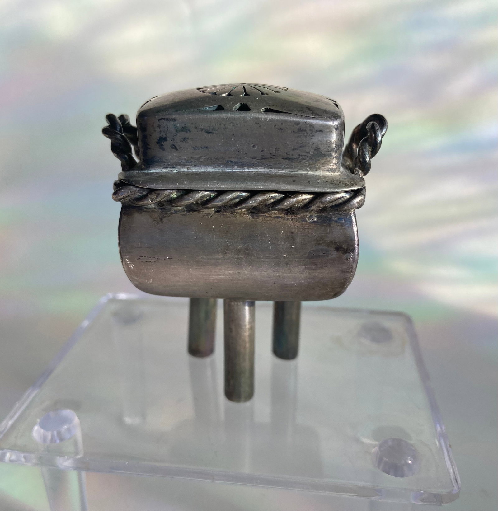A Chinese silver 3-foot censor burner stamped Chinese "CHUN YIN" at bottom: 19th century, Lidded vessel with perforated top for smoke release, and central tube or socketed stem,Chain attachment loops; Weight: 68 gram. Dimensions?HEIGHT: 2.5 inches
