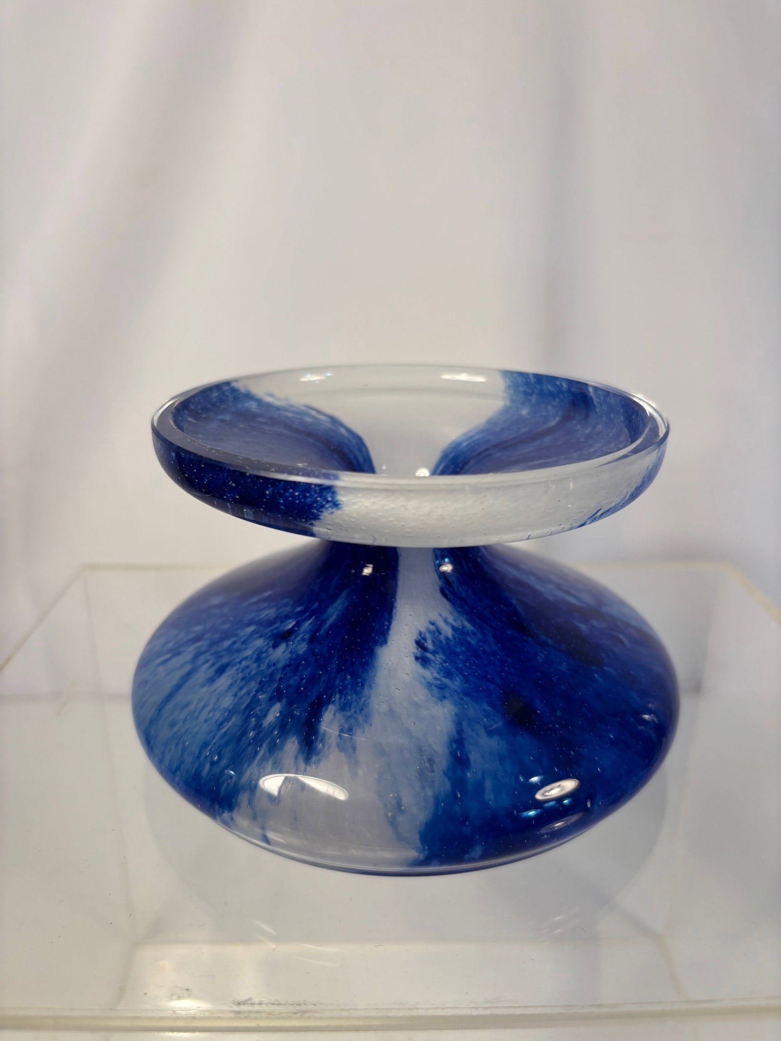 A Swedish Cobalt Blue Sommerso Art Glass Compote / Bowl, c. 1960–1980: A striking mid-century Scandinavian art glass compote, featuring a cobalt blue and clear sommerso swirl design. The piece is hand-blown with a concave center and gently flared rim, creating a dynamic 
