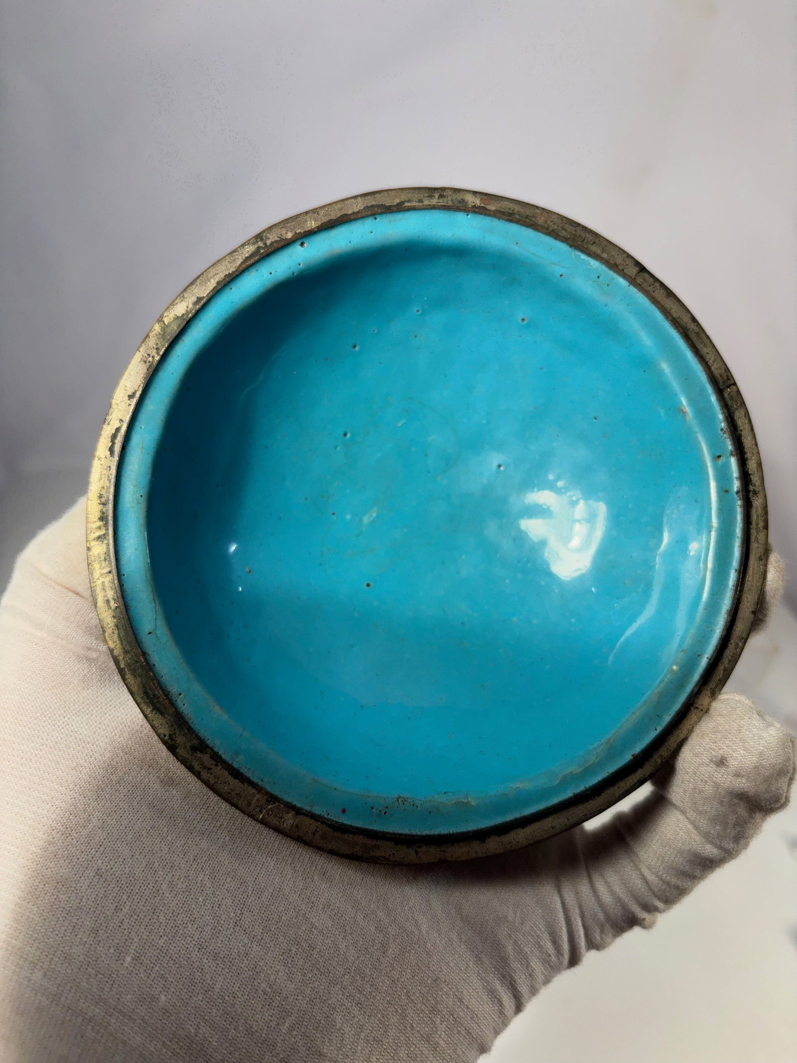 A Tibetan Metal-Mounted Covered Lacquer Bowl with Coral Inset Decoration, 19th Century: Tibetan or Himalayan metal-mounted covered bowl of rounded form with domed lid, richly decorated with repoussé and cast metalwork featuring scrolling and foliate motifs.extensively embellished with c