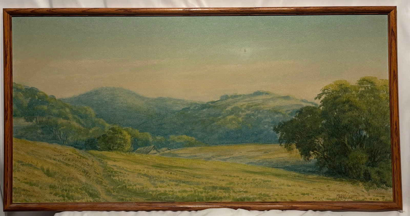 Marius Schmidt (Danish-American, 1868–1938) Landscape, Oil on Canvas: Oil on canvas landscape depicting rolling hills, trees, and a distant mountain range beneath a clear sky. Signed lower left “Marius Schmidt.” Schmidt was born in Denmark and later became activ