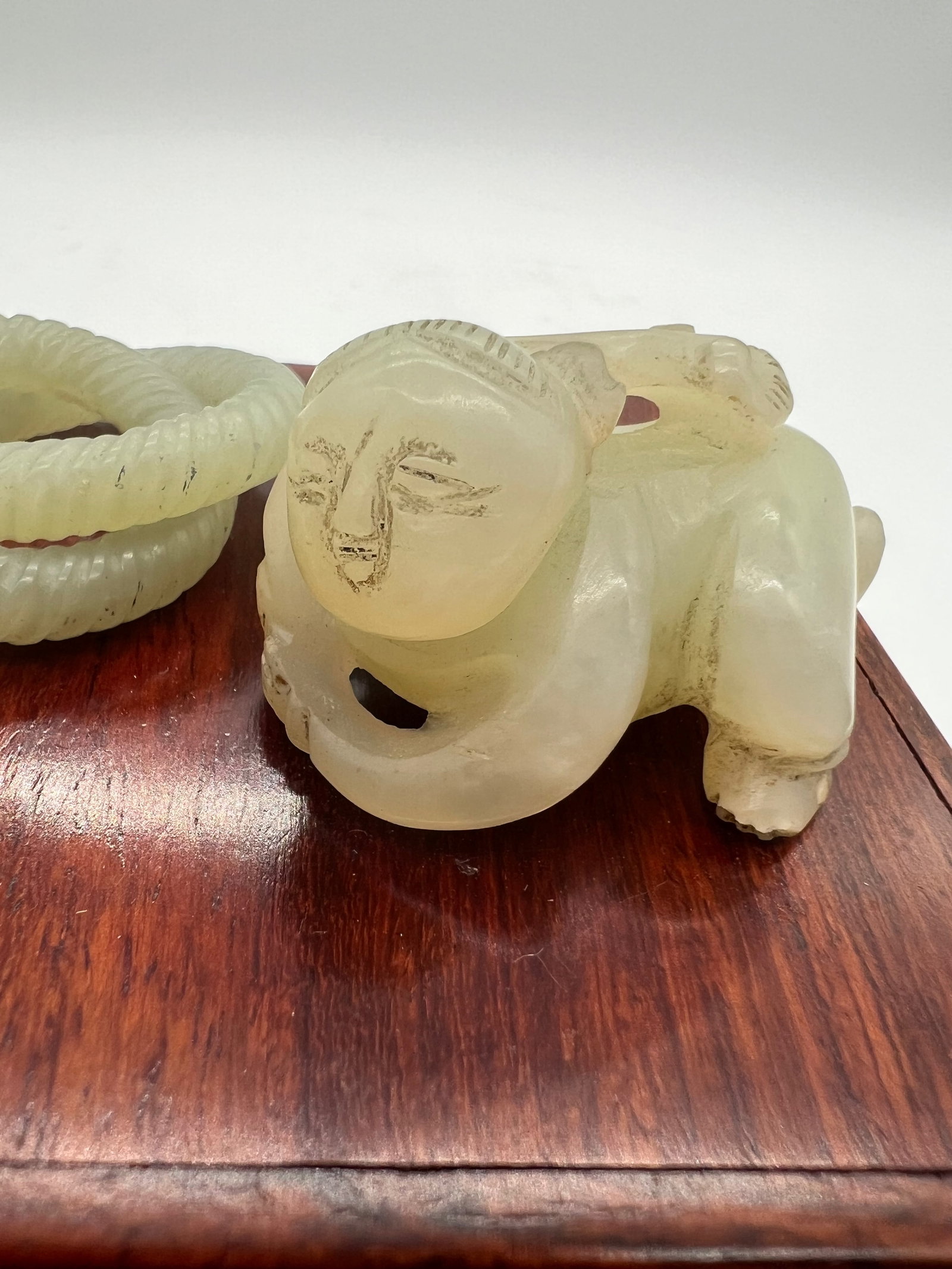 A Jade Boy Statue and two coiled circle Jade Ring - 2