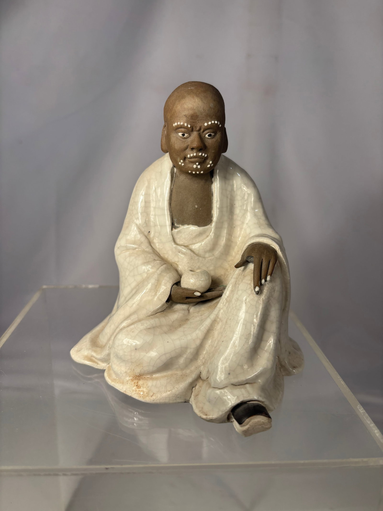 A Chinese Shiwan Style Crackle Glazed Seated Figure (1 of 7)