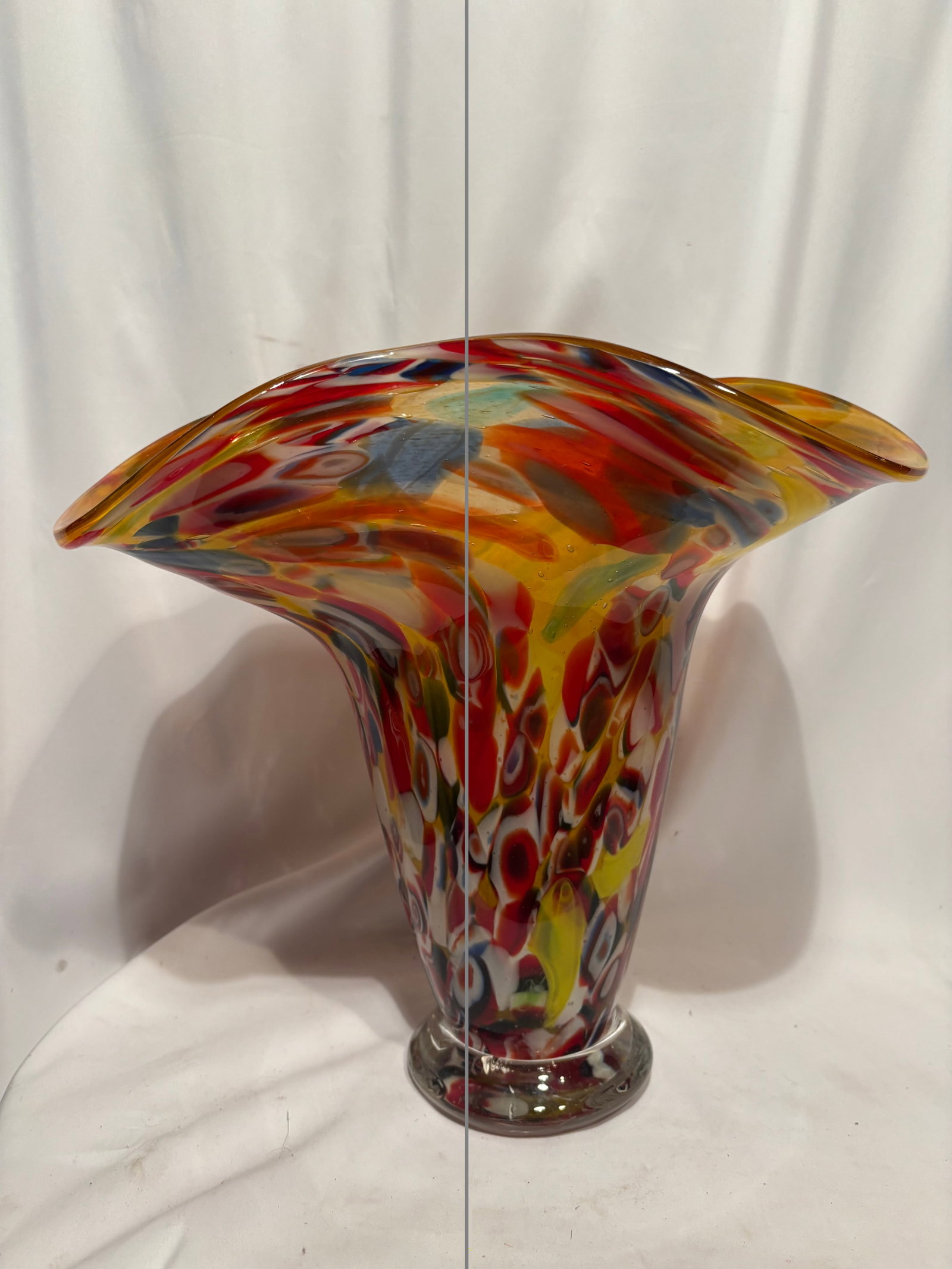 Large Murano Style Millefiori Art Glass Trumpet Vase: Hand-blown art glass trumpet vase featuring a wide flared rim and vibrant multicolored millefiori decoration throughout. The vase incorporates numerous colorful murrine canes suspended within a golden