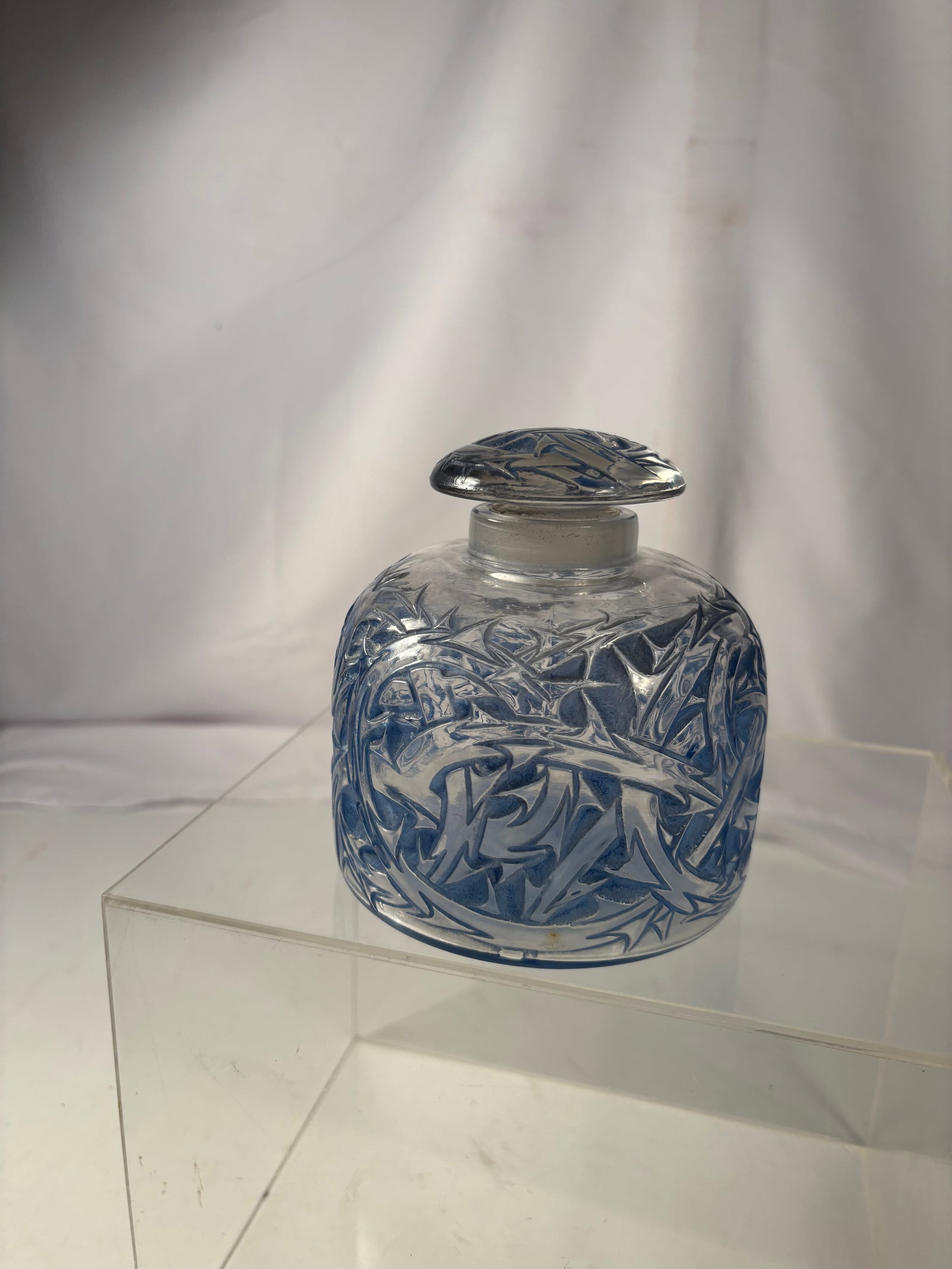 Large René Lalique “Epines?? Frosted Blue Glass Perfume Bottle, France: René Lalique (French, 1860–1945) “Epines” perfume bottle, executed in frosted and clear molded glass with blue patinated decoration. The design features an allover relief pattern of intertw