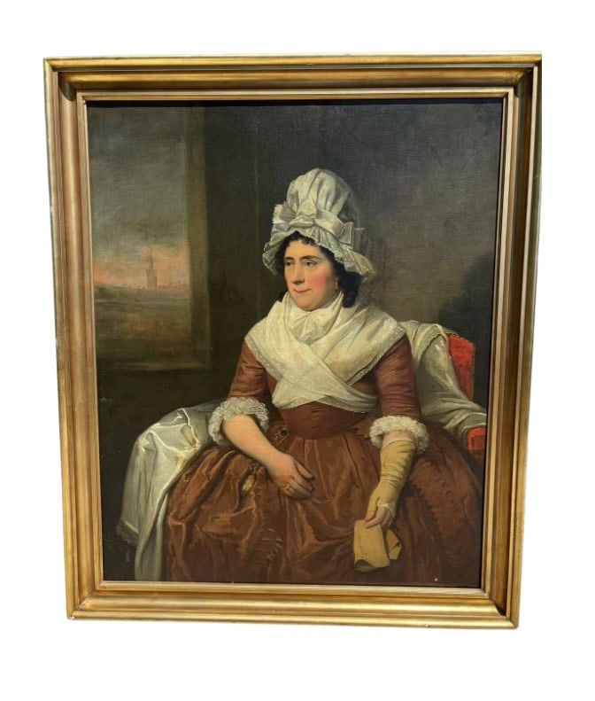 Portrait of a Seated Lady in Brown Silk Dress, 18th Century Manner: 18th century, Oil on canvas portrait depicting a dignified lady seated indoors, wearing a brown silk dress with white lace cuffs, and a layered white headwrap. She holds a yellow glove and a rolled le