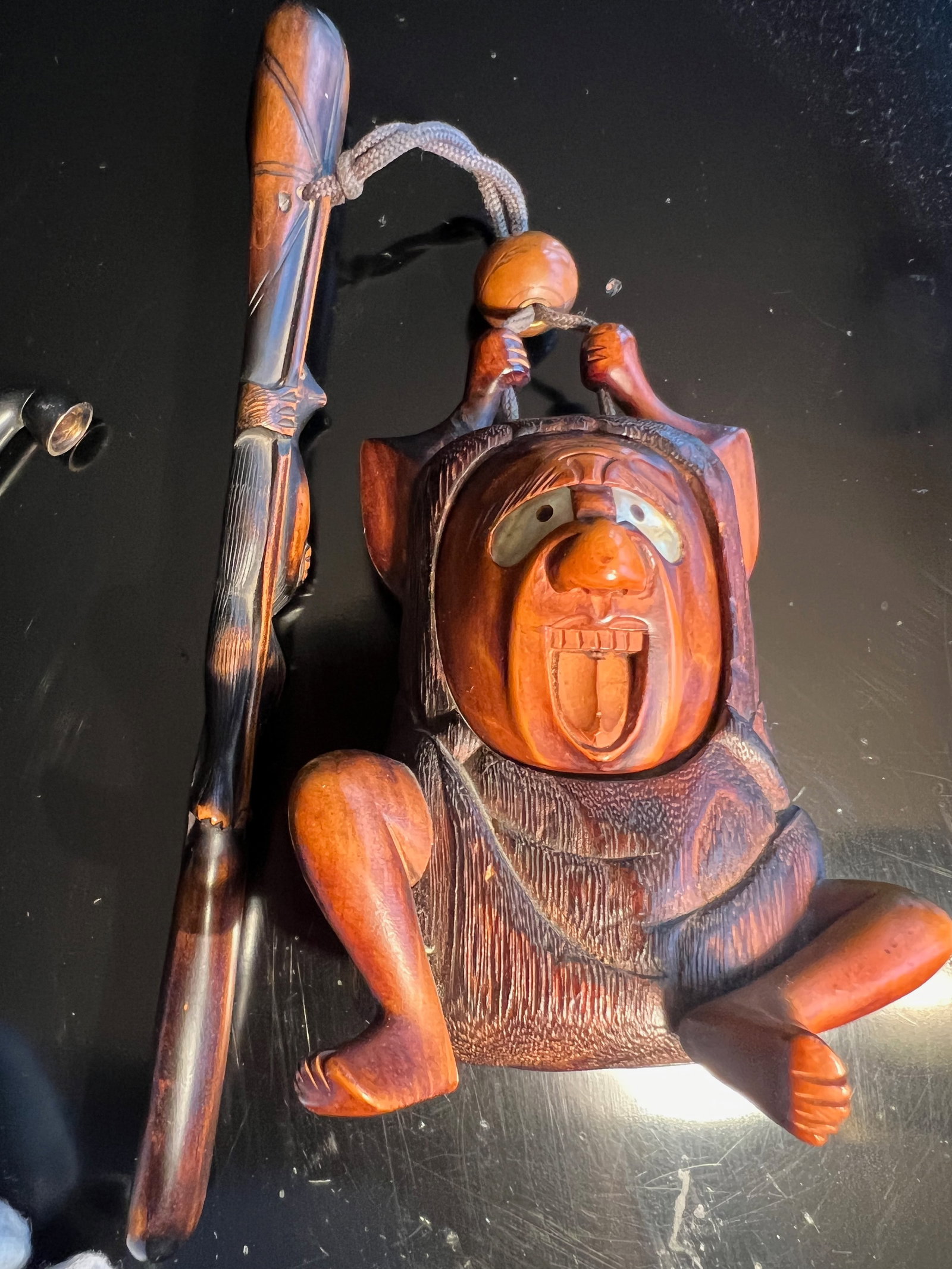 A Japanese Kiseruzutsu with Tabako-ire: Late 19th century to early 20th cenury; Pipe holder with tobacco holder in the form of daruma.Used for carrying smoking pipes and tobacco, kiseruzutsu were often elaborate and featured intricate tobac