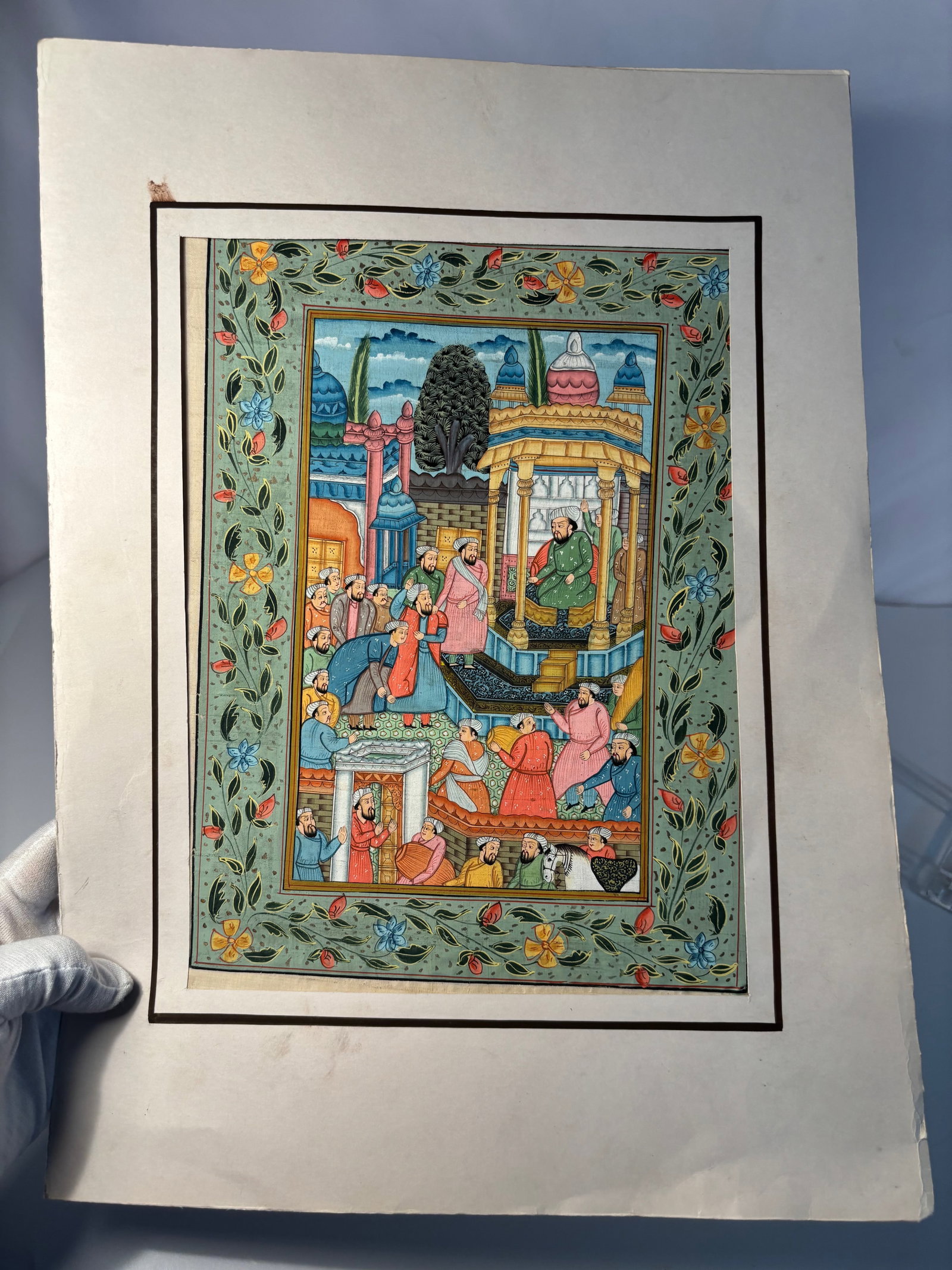 Indian Miniature Gouaches on Paper, Courtly and Processional Scenes, Rajasthani/Indo-Persian Style: 19th century to 20th century; Indian miniature, gouache on paper, depicting a nobleman on horseback accompanied by six attendants carrying spears. The figures wear richly patterned robes and turbans, 