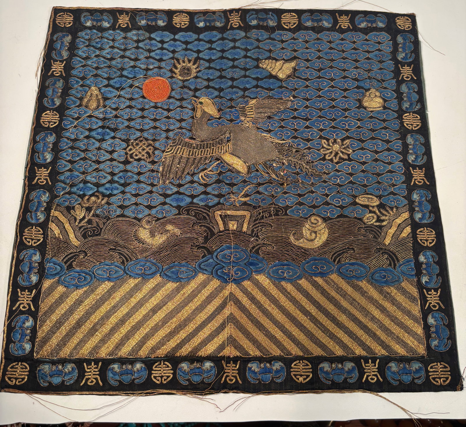 A Fine Qing Dynasty Embroidered First-Rank Civil Badge (Buzi) with Coral Bead Sun, (1 of 7)